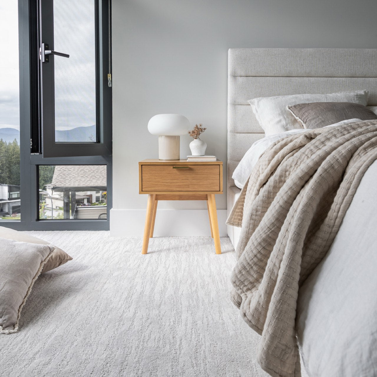 White bed with a white mattress on a white background