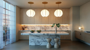 Jupiter Pendant 28" in aged brass styled in a bright kitchen for warm, layered light at Laurie Yapp Home.