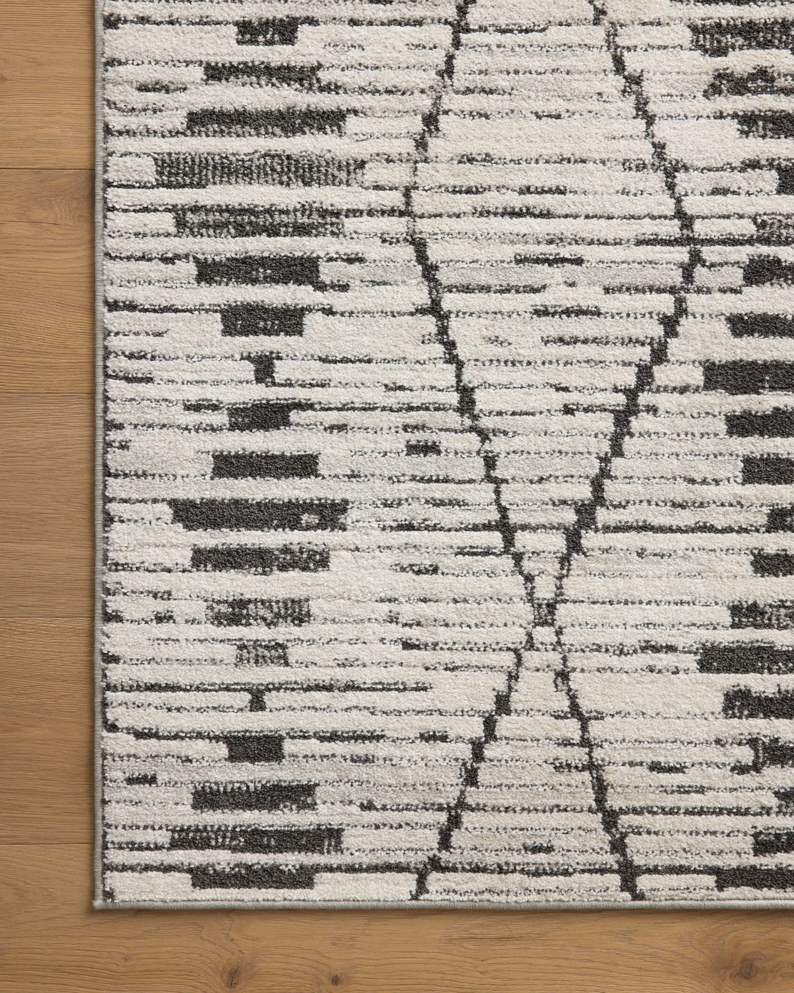 lifestyle view of Kamala Charcoal / Dove luxury Rug