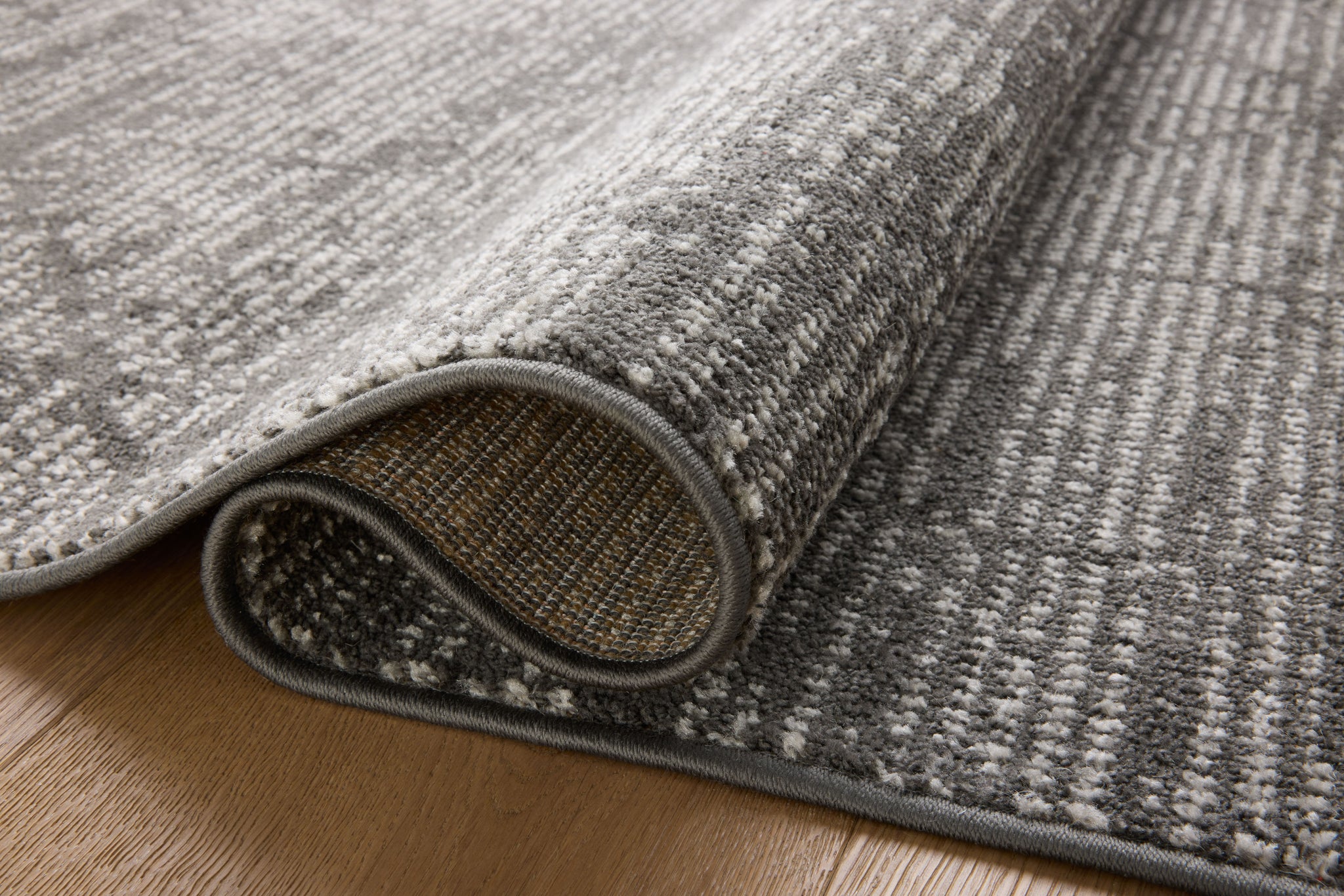 detail view of Kamala Charcoal / Ivory luxury Rug