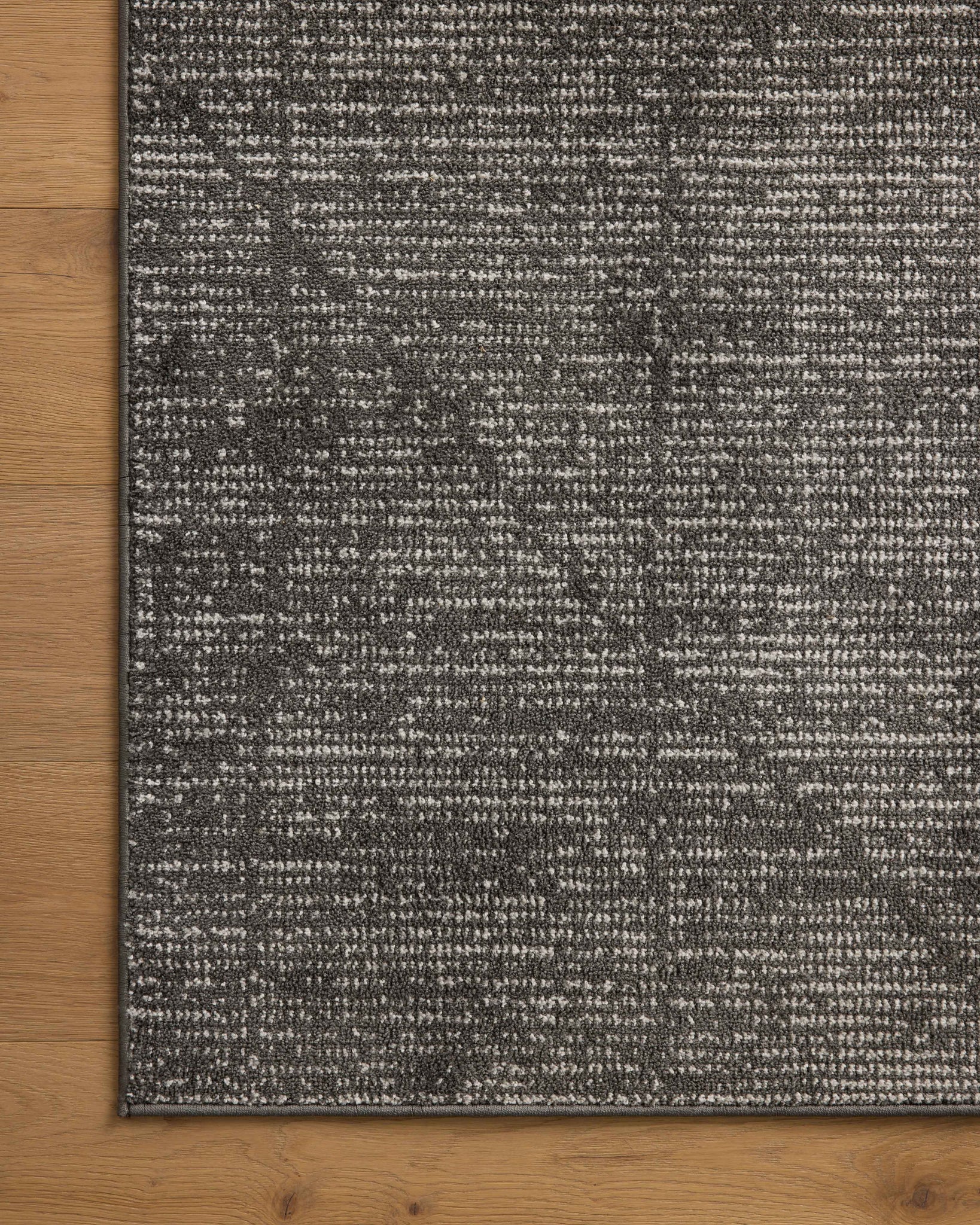 lifestyle view of Kamala Charcoal / Ivory luxury Rug