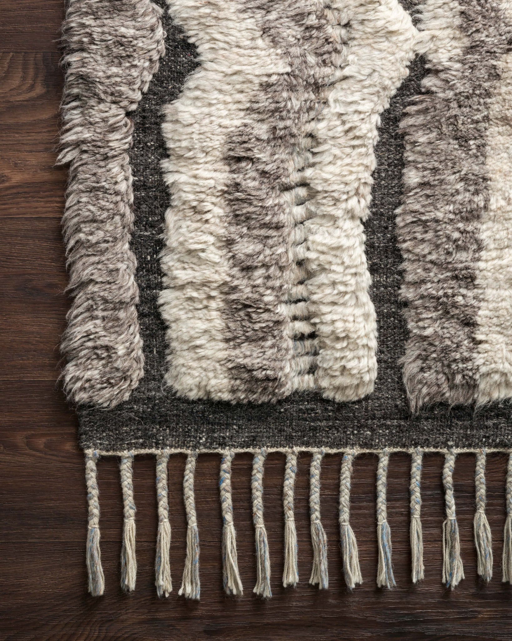side view of Khalid Stone / Charcoal luxury Rug