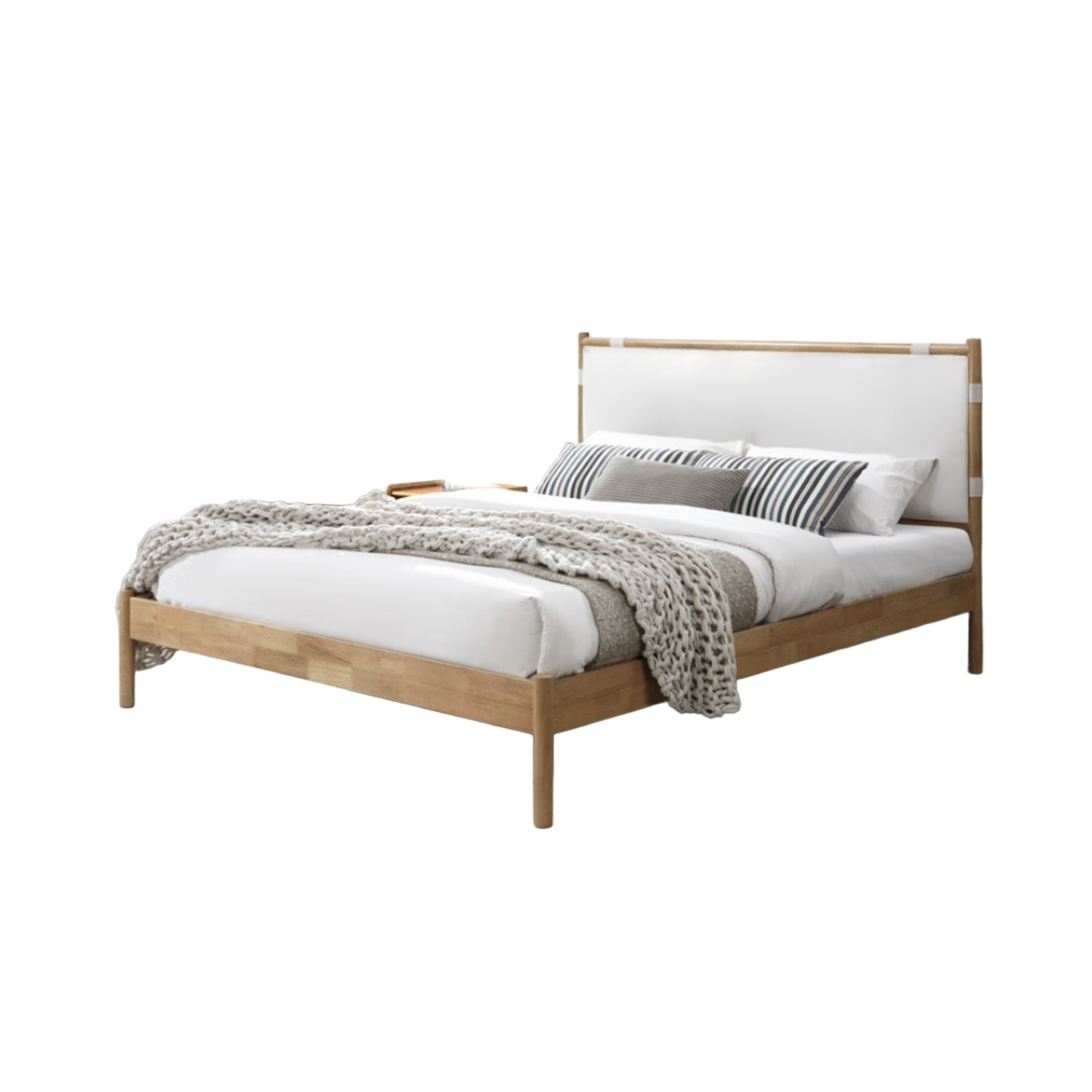 Wooden bed with white mattress and decorative pillows on a white background