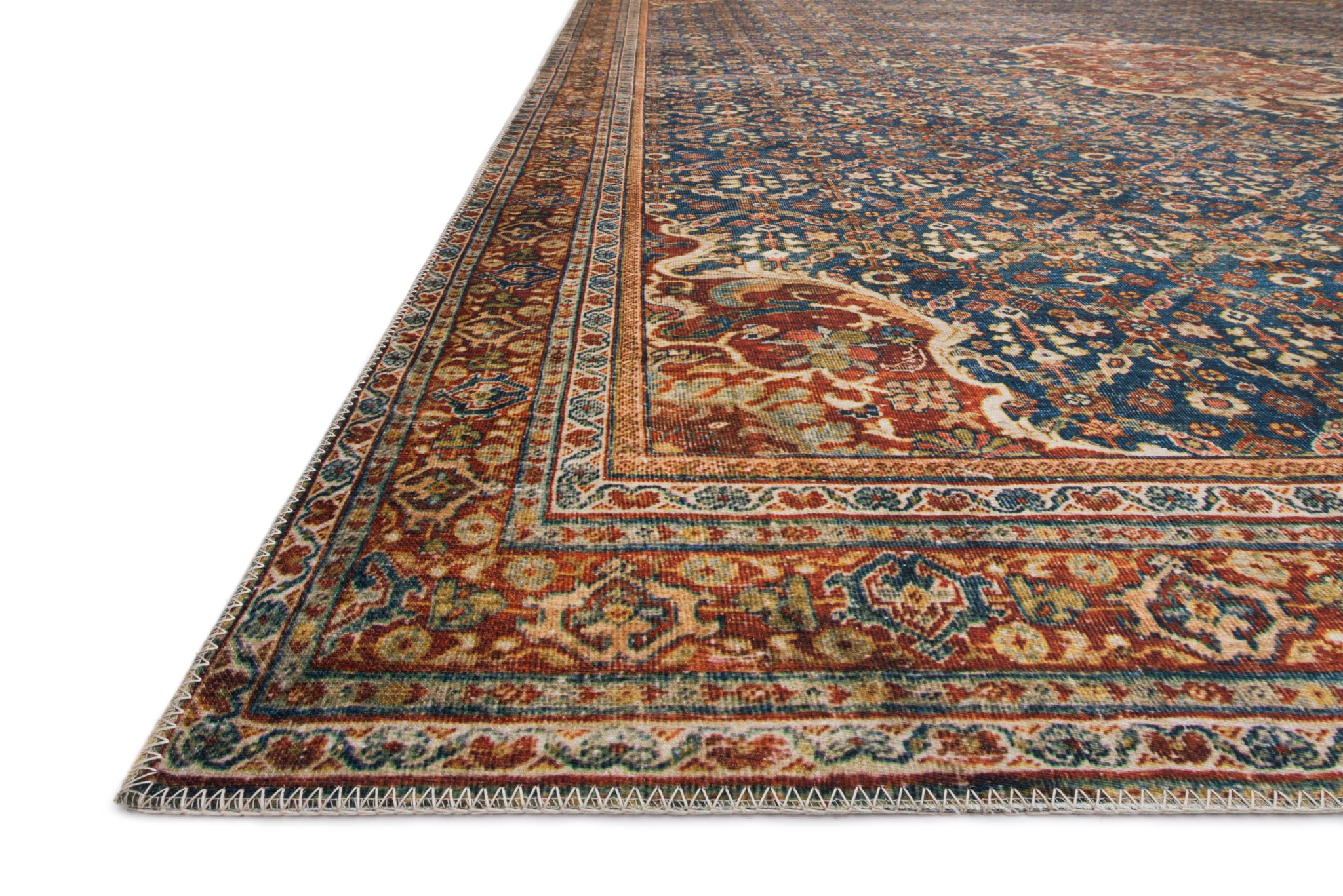 side view of Layla Cobalt Blue / Spice luxury Rug