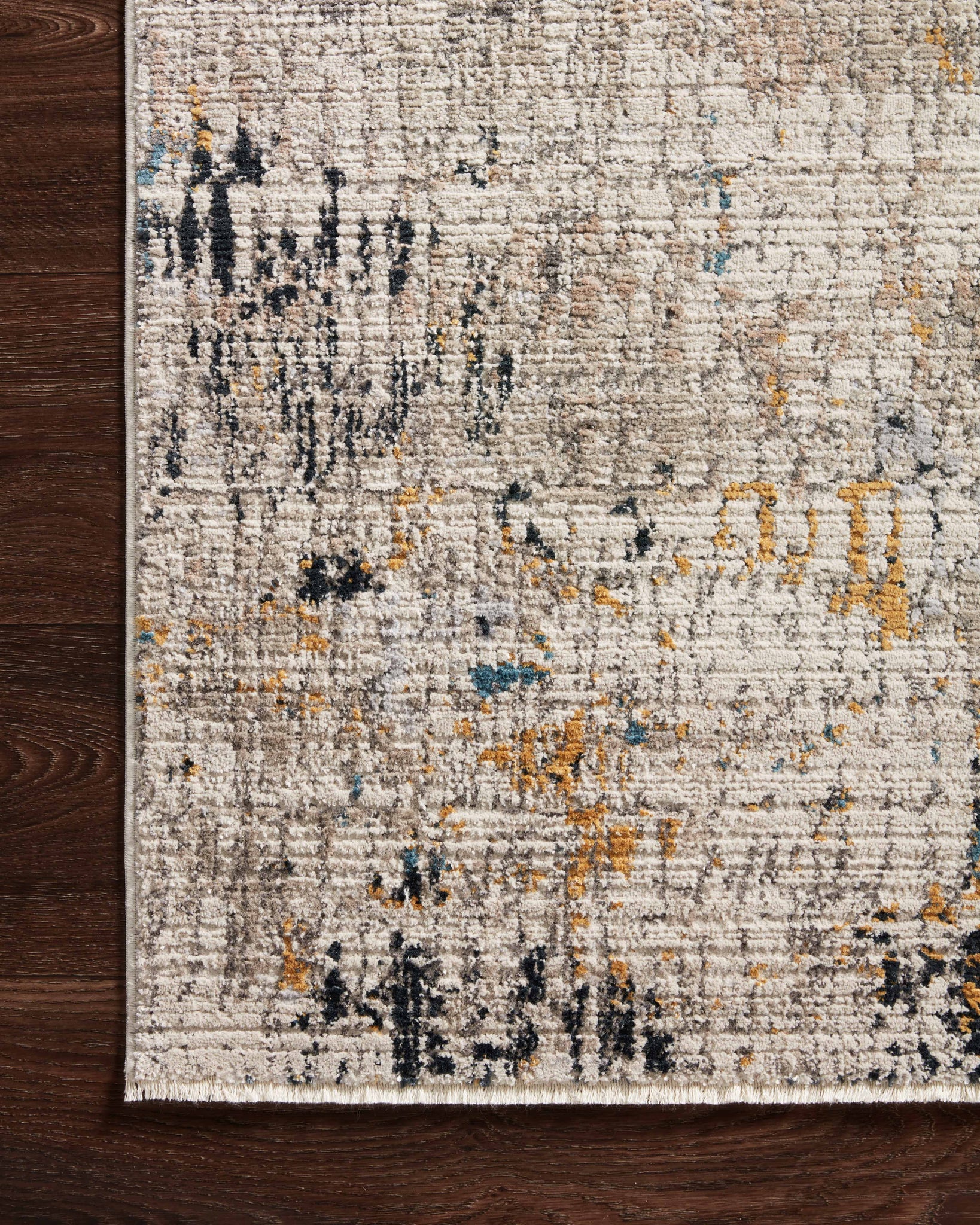 side view of Leigh Ivory / Granite luxury Rug
