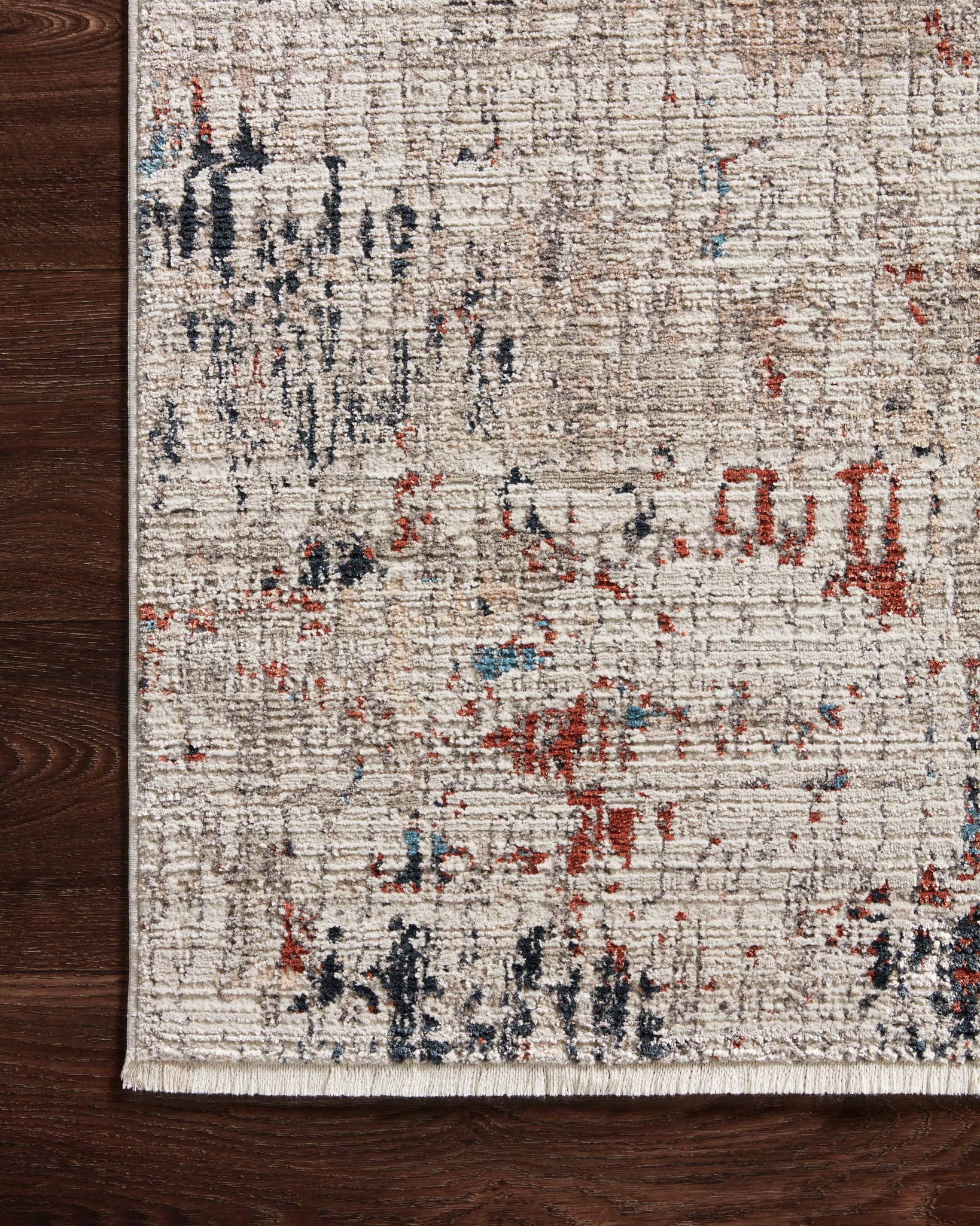 side view of Leigh Ivory / Multi luxury Rug