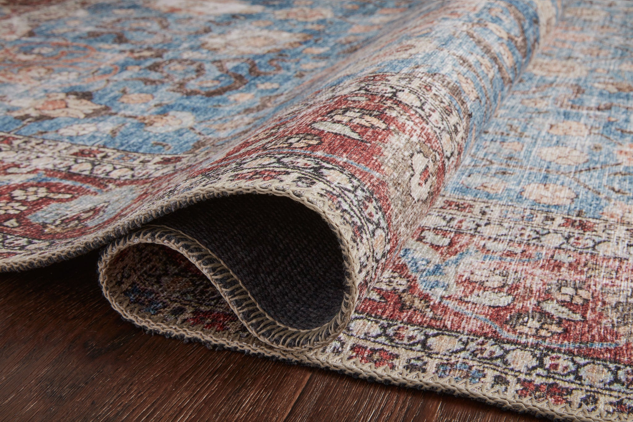 lifestyle view of Loren Blue / Brick luxury Rug