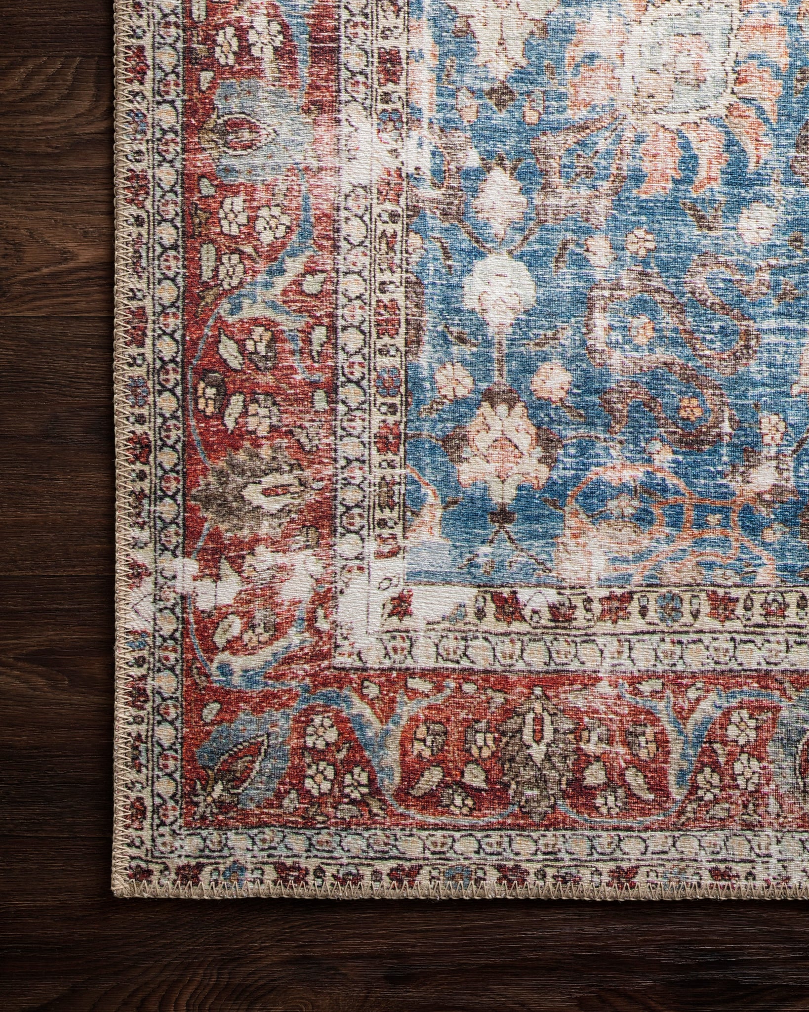 lifestyle view of Loren Blue / Brick luxury Rug