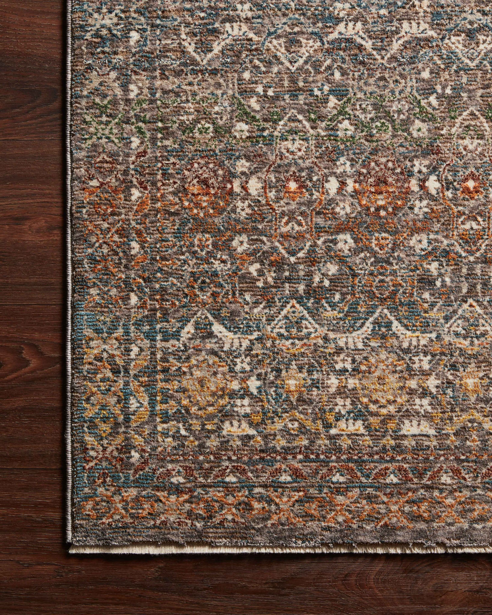 side view of Lourdes Stone / Multi luxury Rug