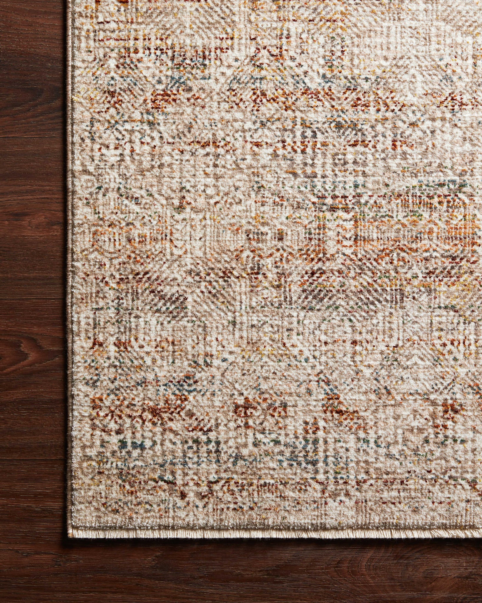 side view of Lourdes Ivory / Spice luxury Rug