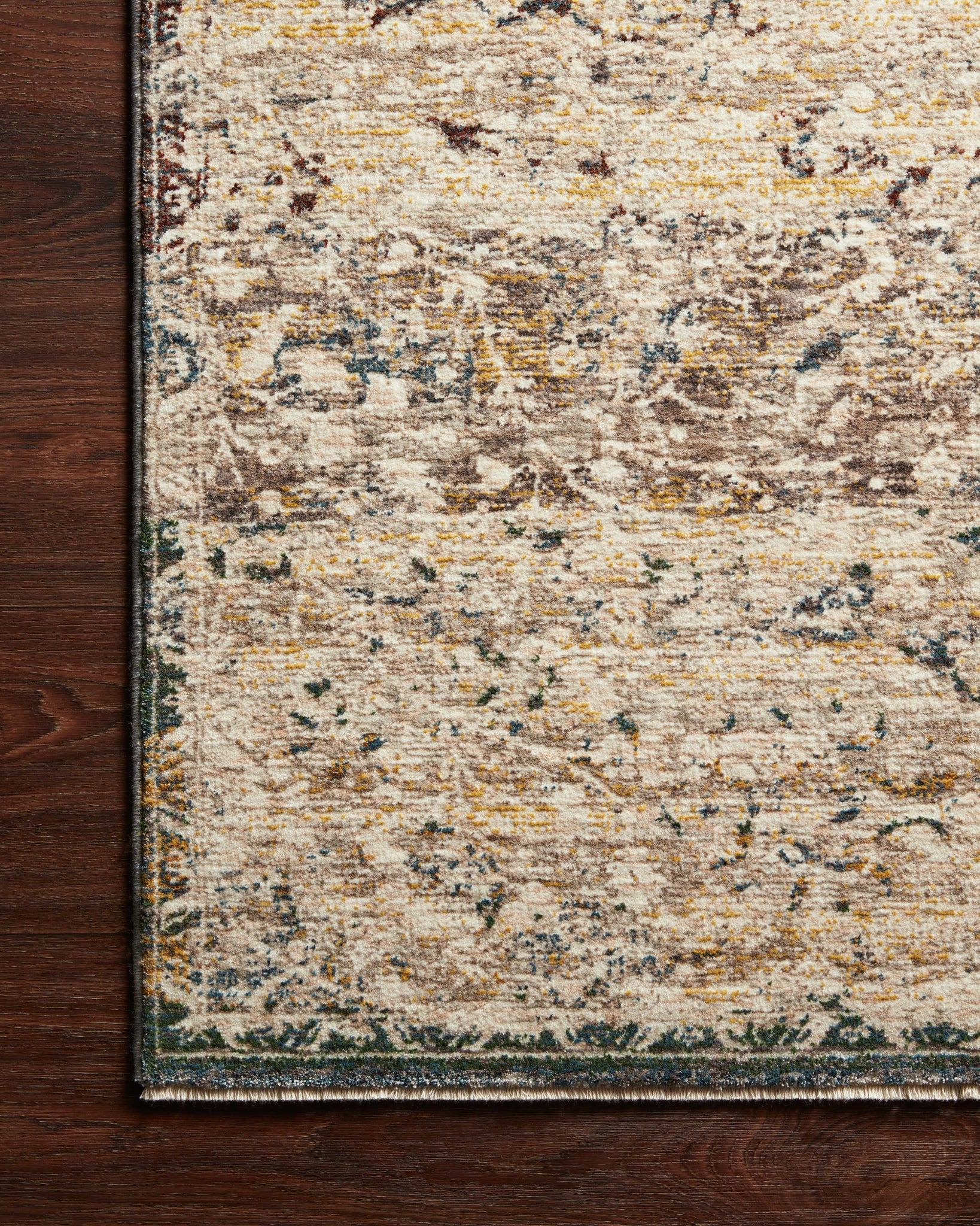 side view of Lourdes Ivory / Multi luxury Rug