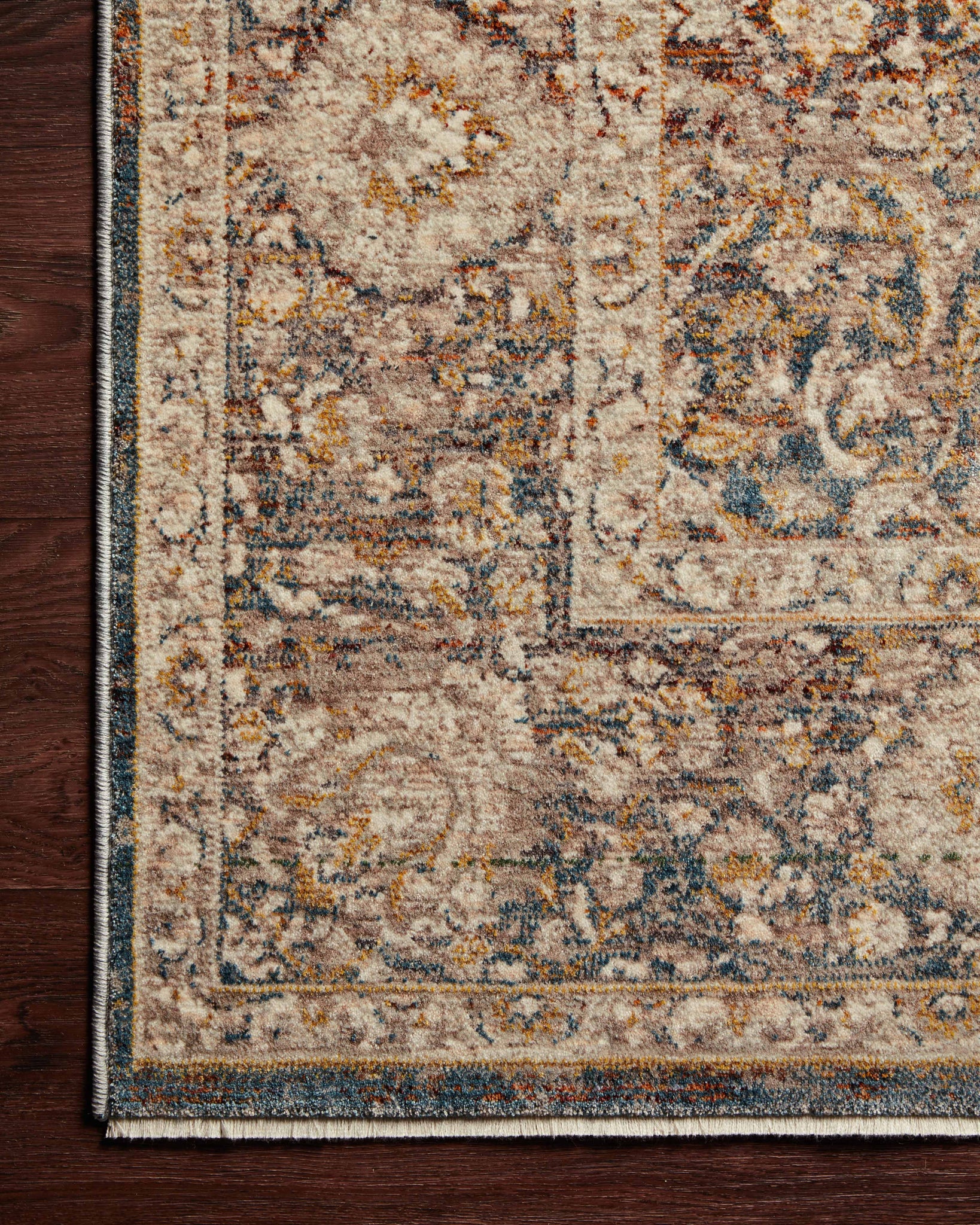 side view of Lourdes Charcoal / Ivory luxury Rug