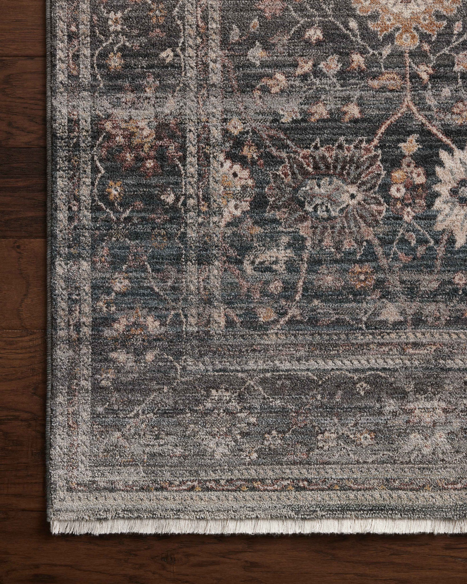 side view of Lyra Ink / Multi luxury Rug