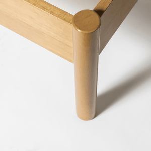 Close-up of a wooden leg on a white background
