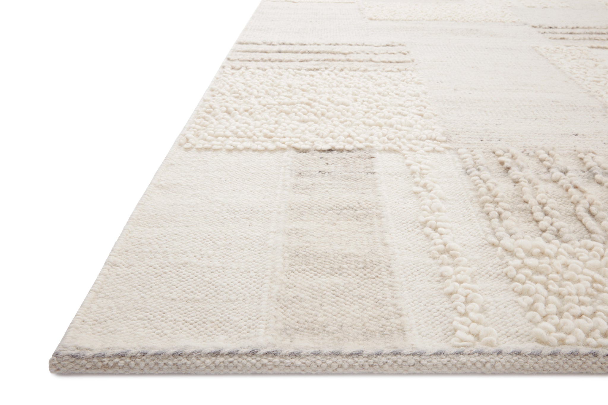 side view of Manfred Ivory / Pebble luxury Rug