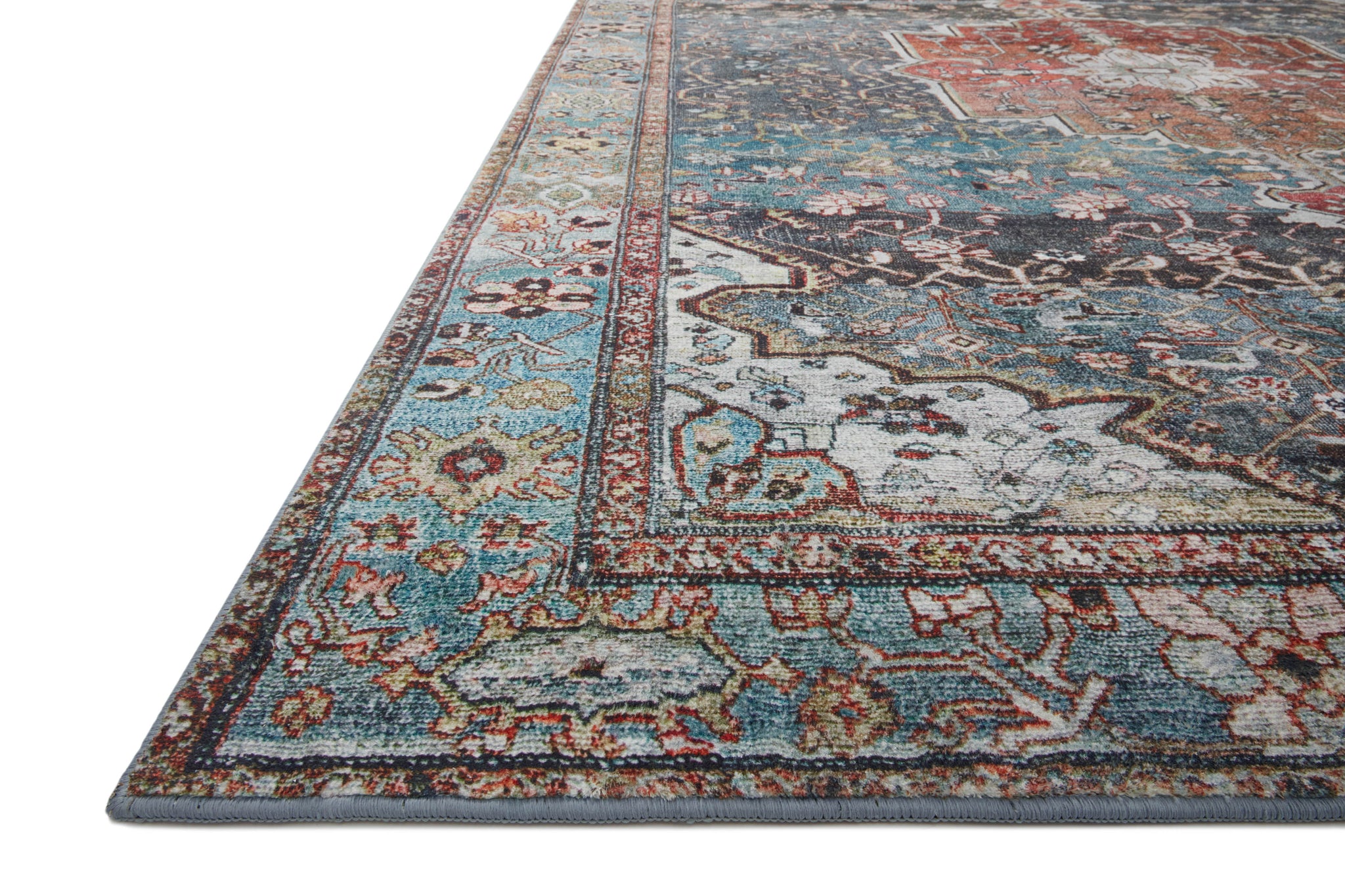 side view of Margot Ocean / Brick luxury Rug