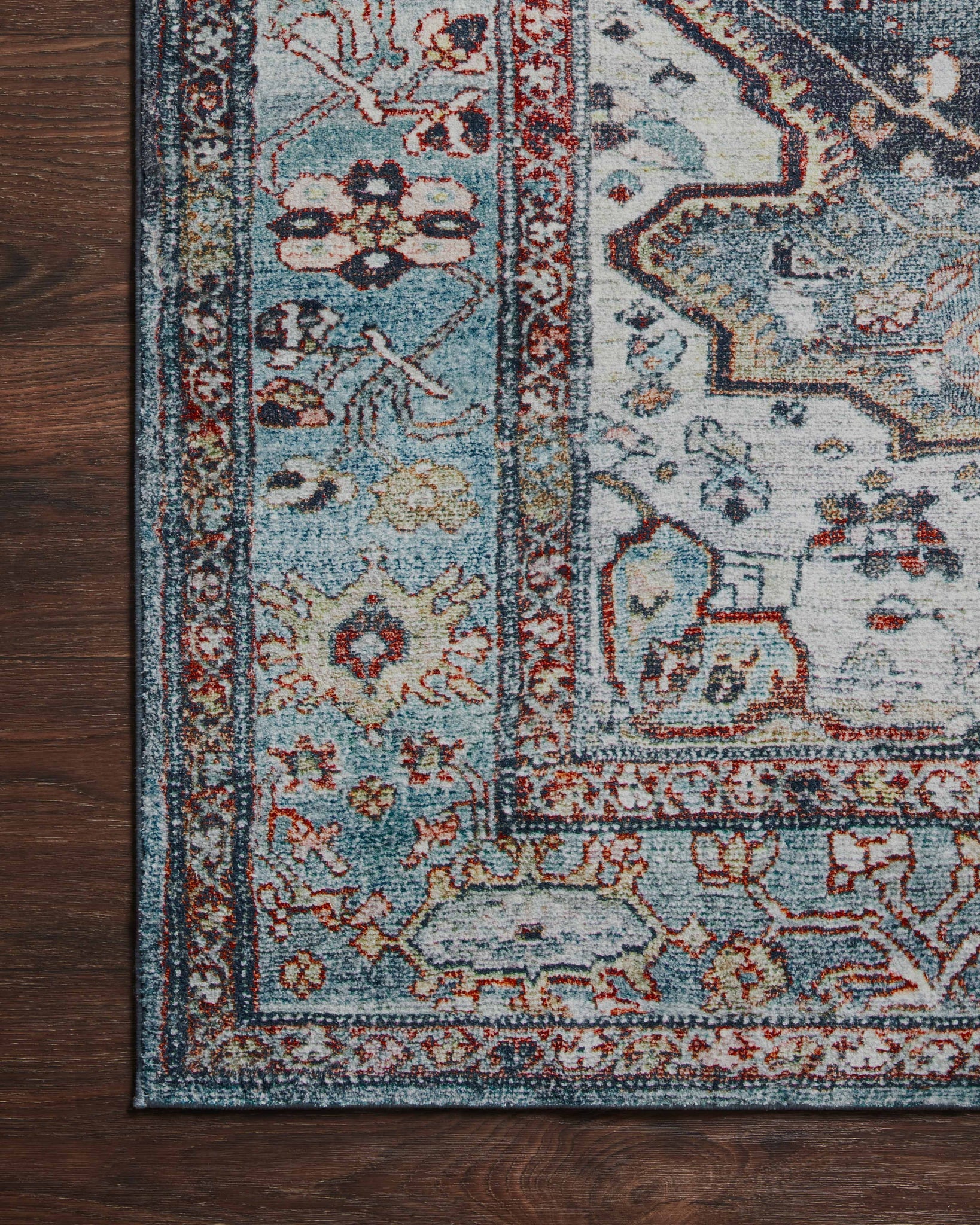 lifestyle view of Margot Ocean / Brick luxury Rug