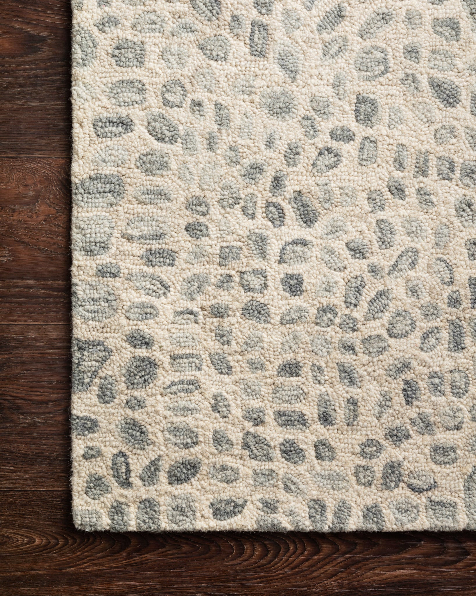 side view of Masai Silver Grey / Ivory luxury Rug