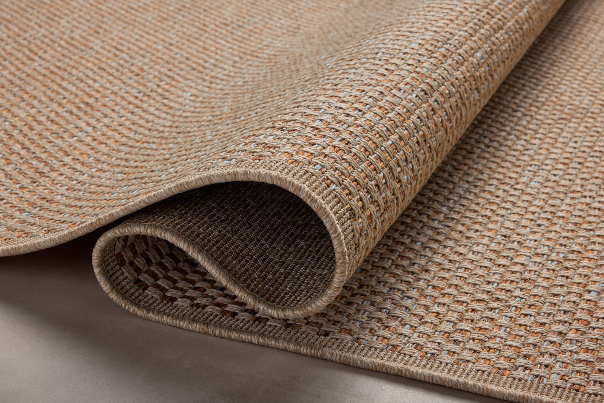 side view of Merrick Oatmeal / Sunrise luxury Rug