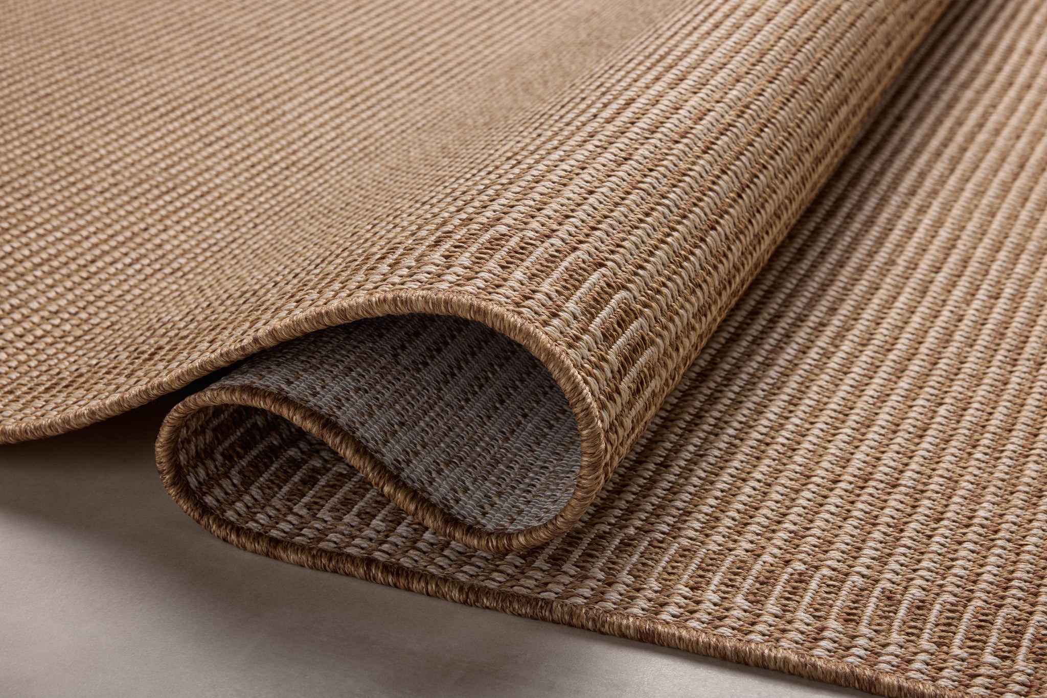 side view of Merrick Natural / Oatmeal luxury Rug