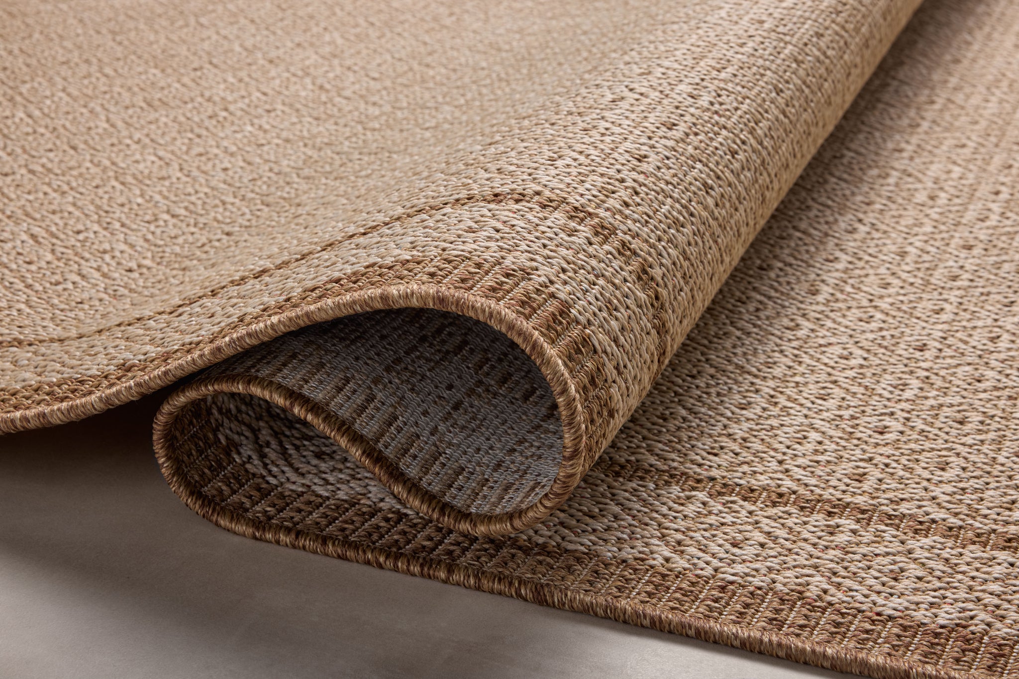 side view of Merrick Chestnut / Oatmeal luxury Rug