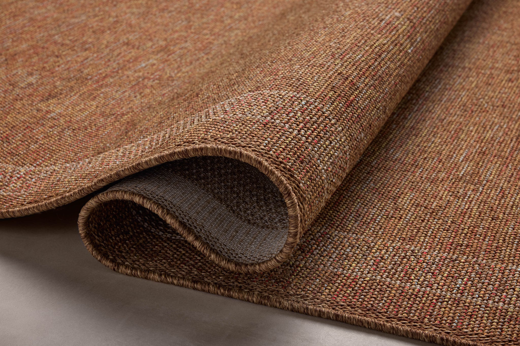 side view of Merrick Cinnamon / Multi luxury Rug