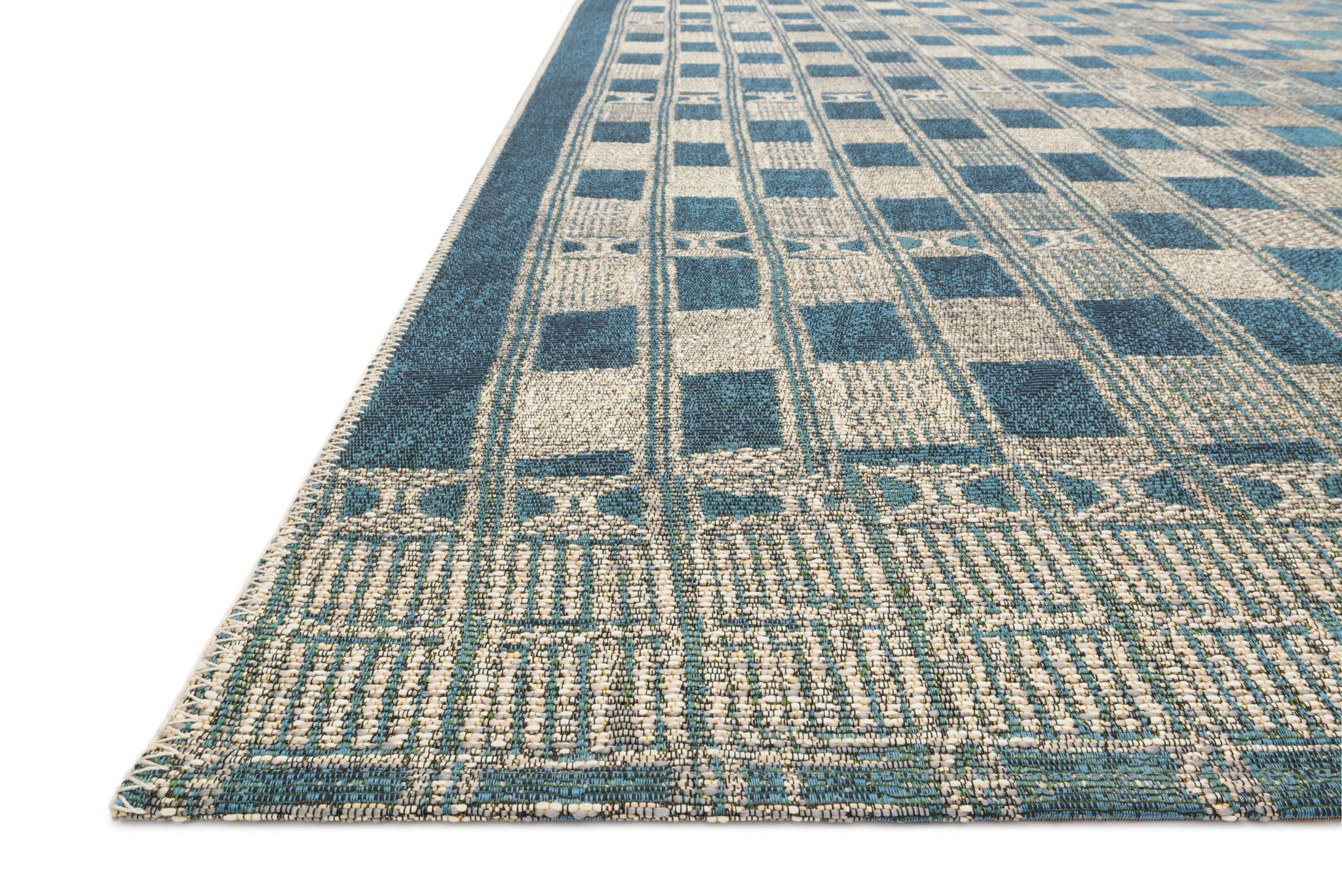 angle view of Mika Blue / Ivory luxury Rug