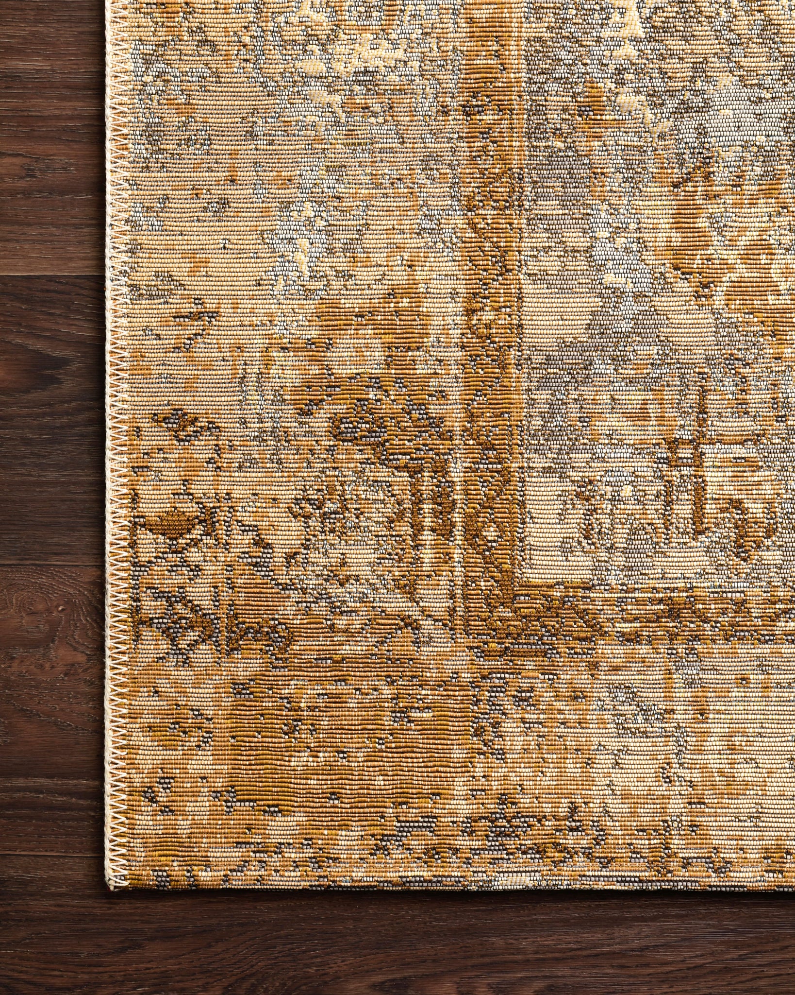 detail view of Mika Ant. Ivory / Copper luxury Rug