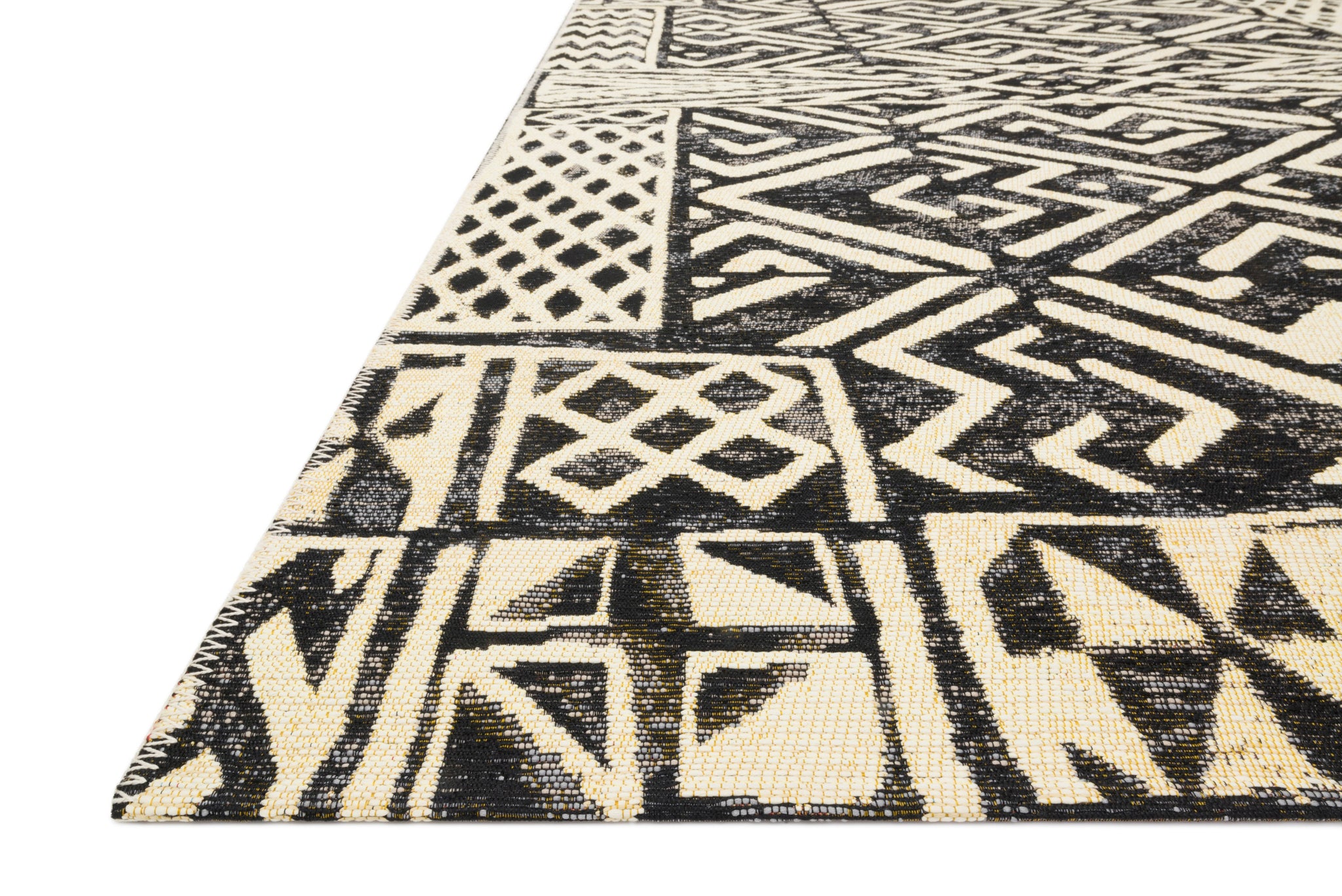 angle view of Mika Ivory / Black luxury Rug