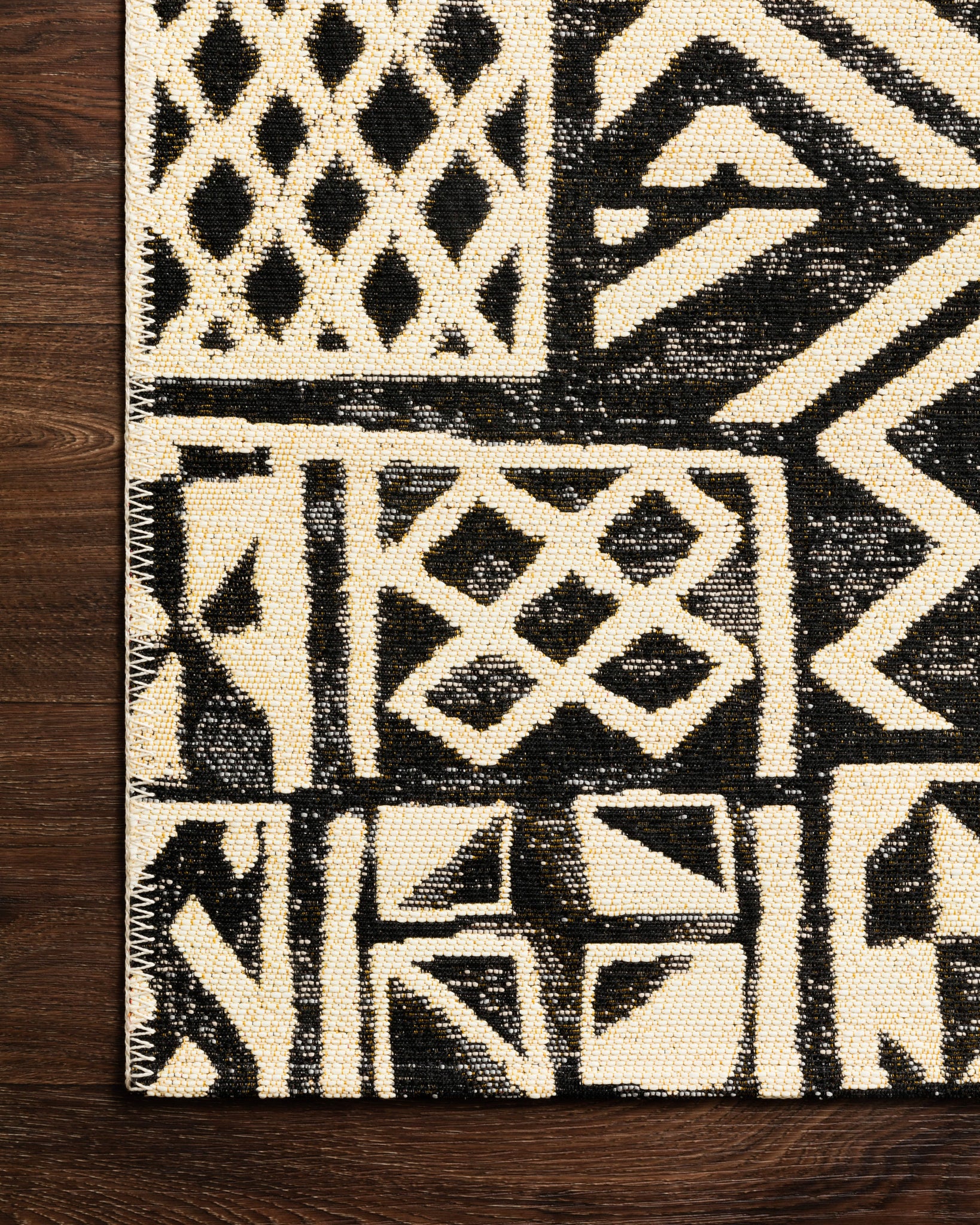 detail view of Mika Ivory / Black luxury Rug