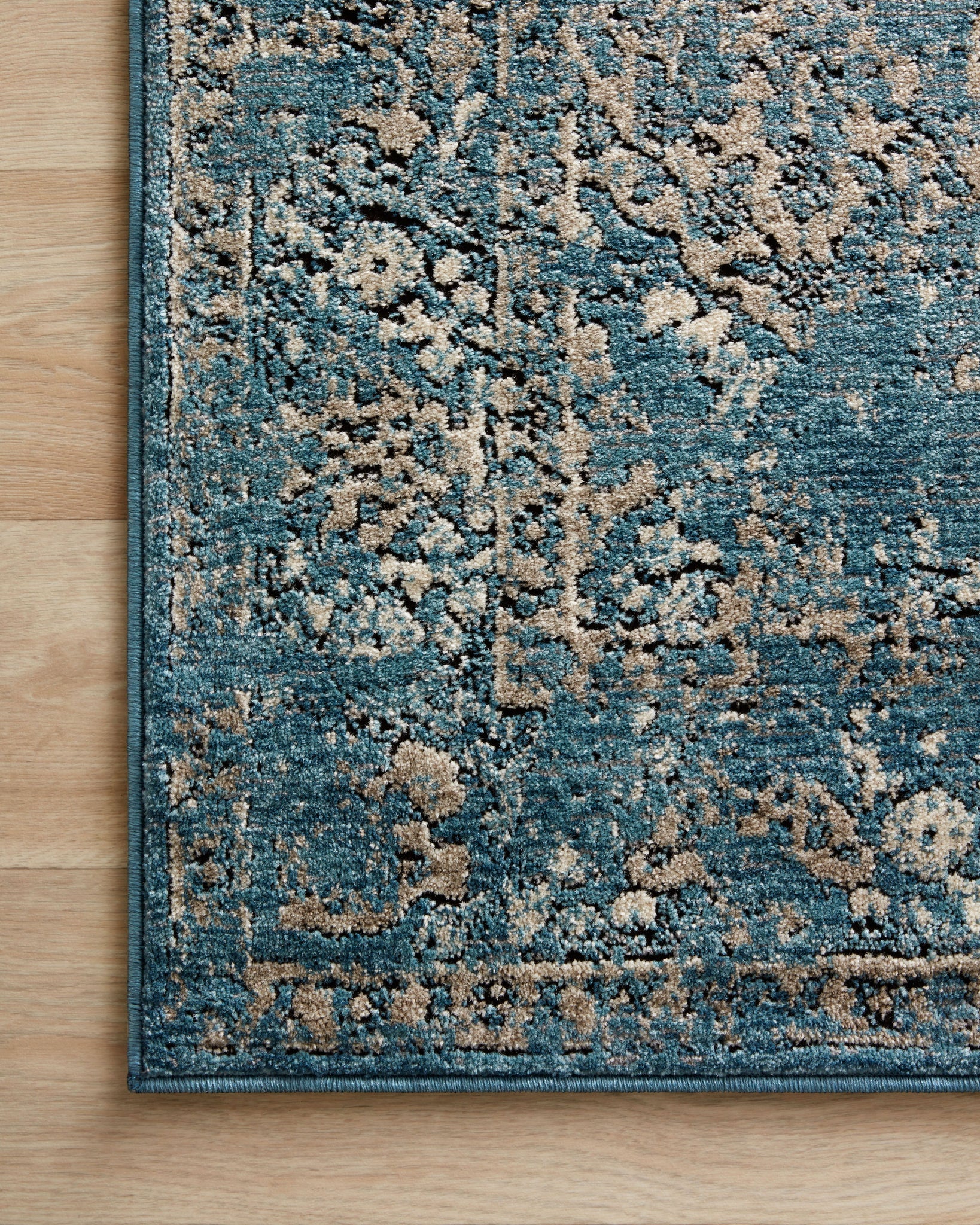 detail view of Millennium Blue / Taupe luxury Rug