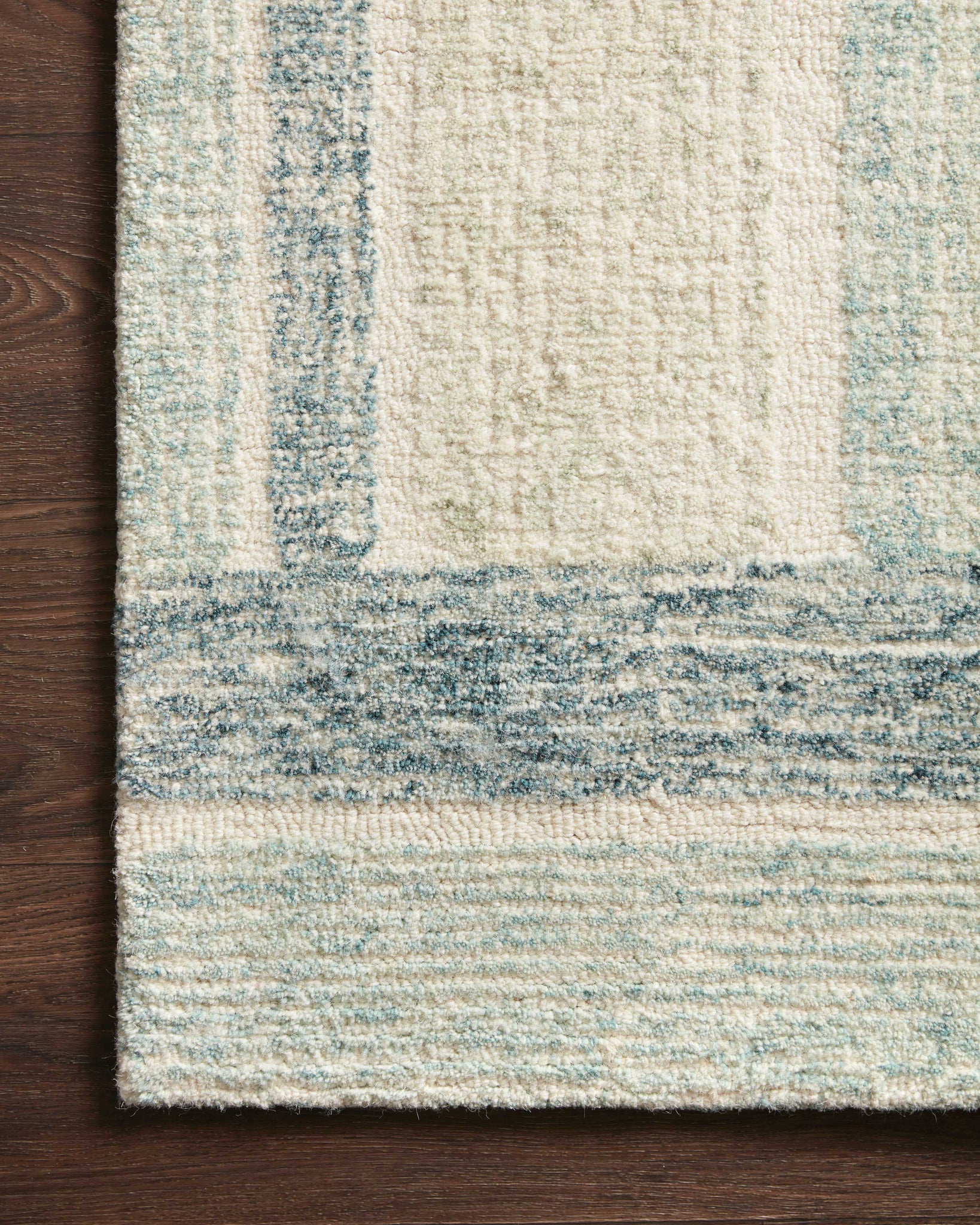 side view of Milo Aqua / Denim luxury Rug