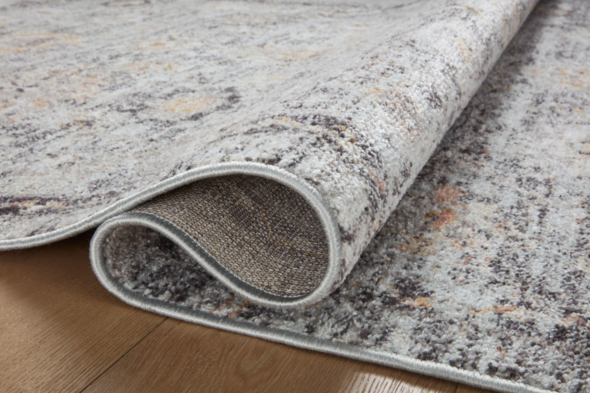 side view of Monroe Sky / Gold luxury Rug