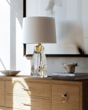 Close-up of the Midura Table Lamp in aged brass showing the base and shade proportions.