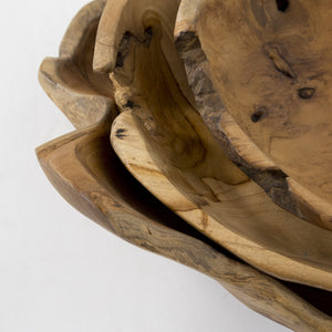 Stack of wooden bowls with natural grain and texture on a white background