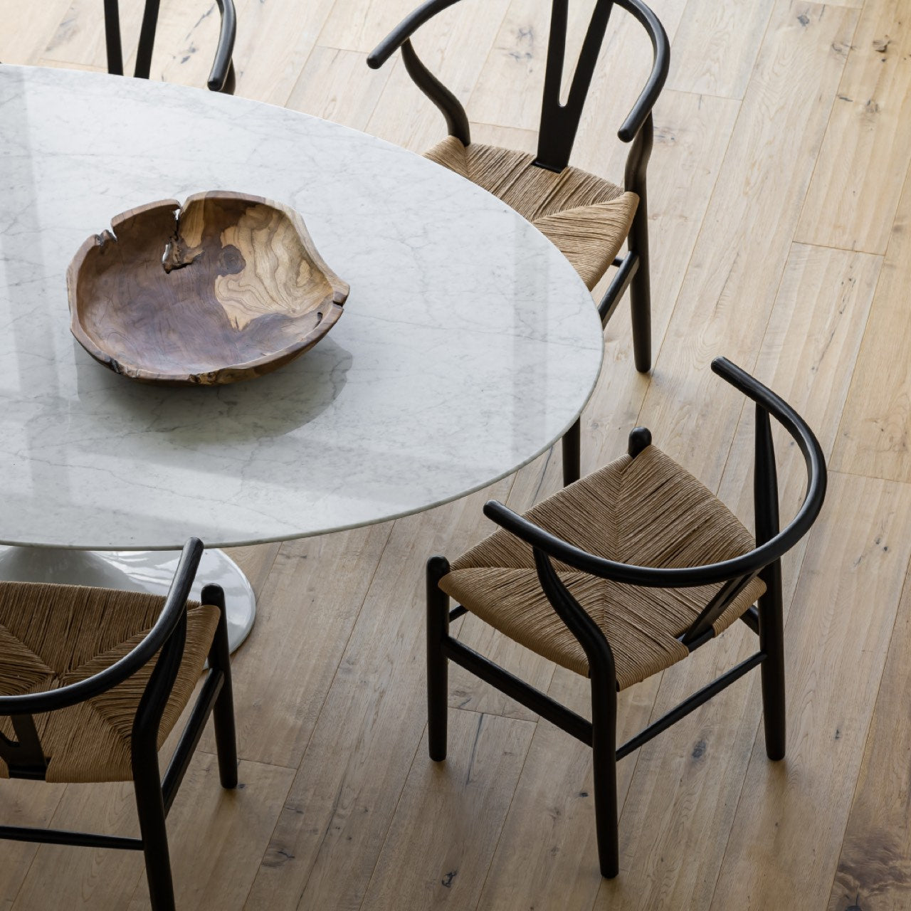 Set of three wooden bowls of different sizes on a white background