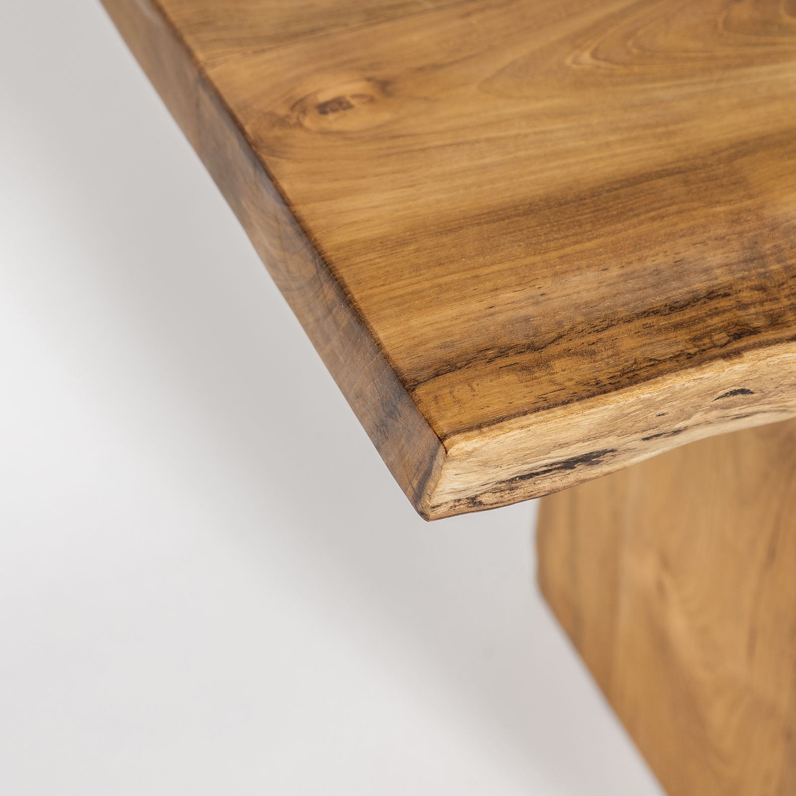 Close-up of a wooden surface with a natural grain pattern on a white background