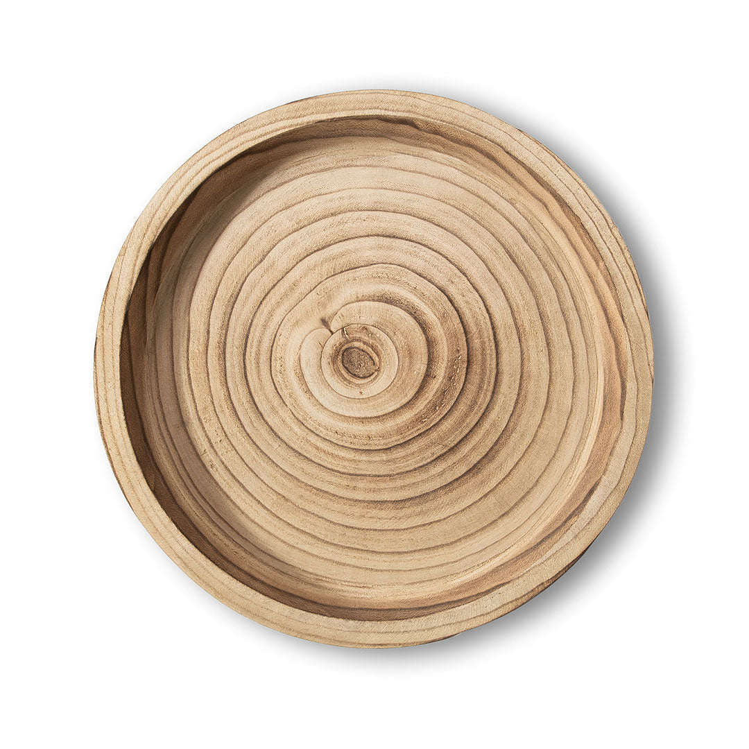 Wooden bowl with concentric circular pattern on a white background