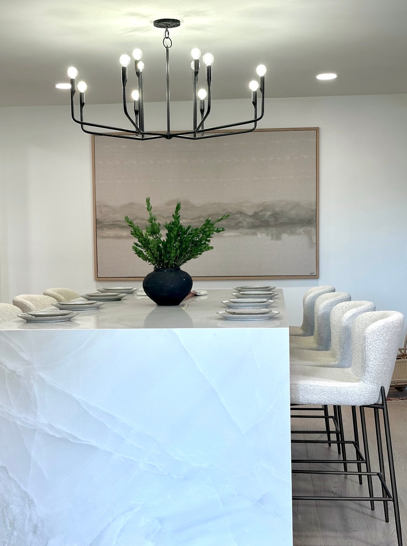 Norman Chandelier 42" styled in an elegant dining room for warm, layered light at Laurie Yapp Home.