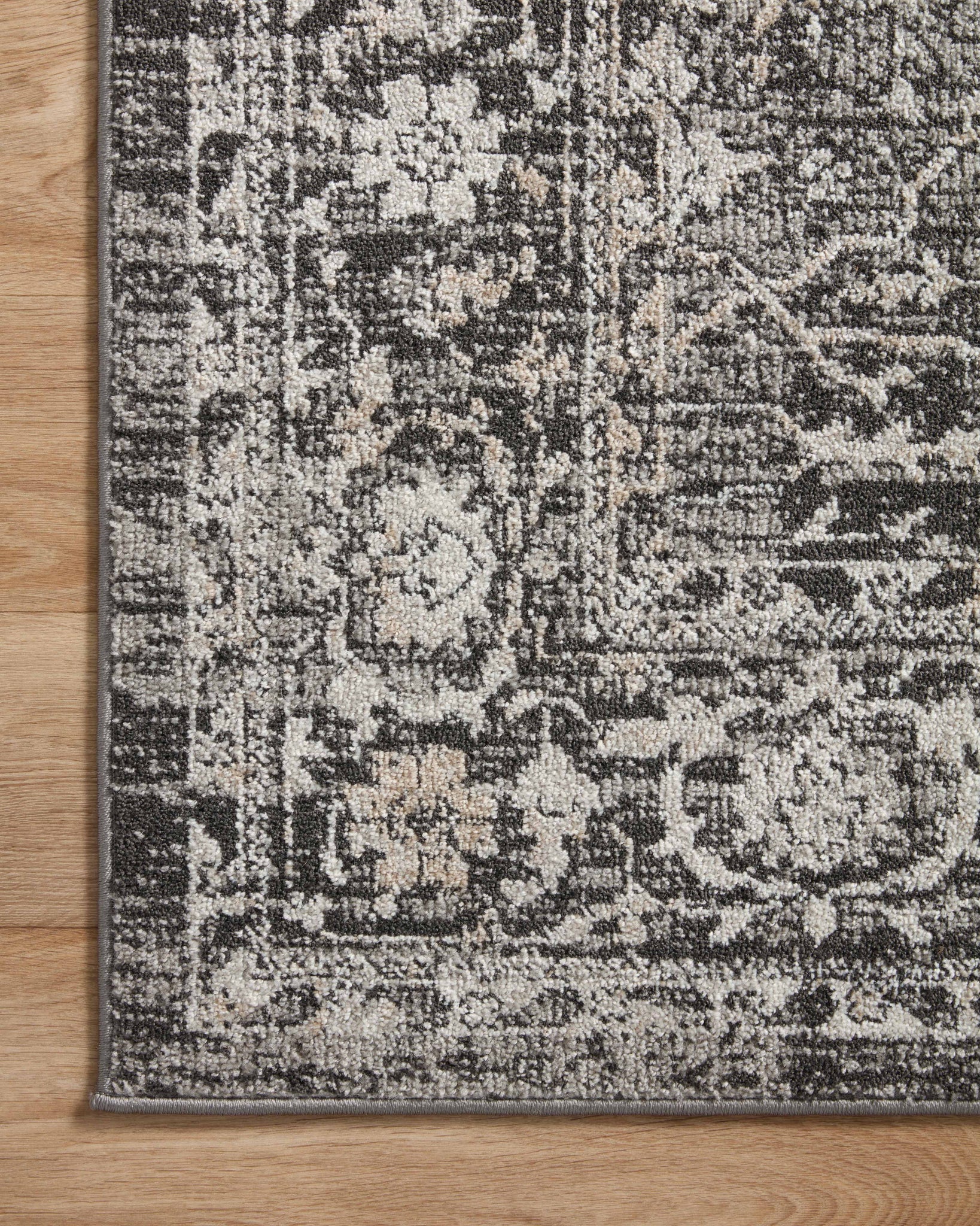 lifestyle view of Odette Charcoal / Silver luxury Rug