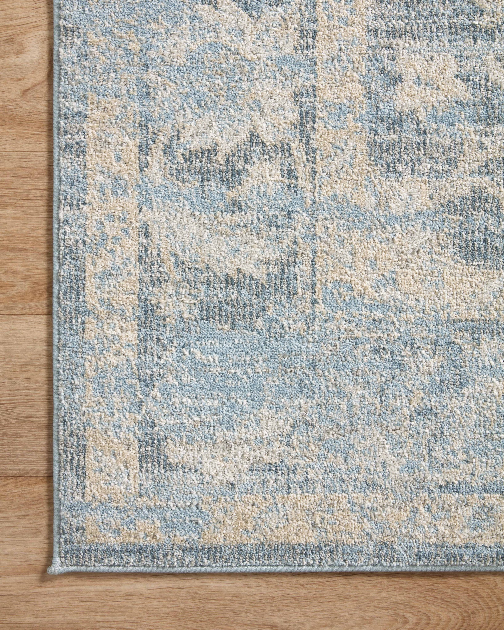 side view of Odette Sky / Beige luxury Rug