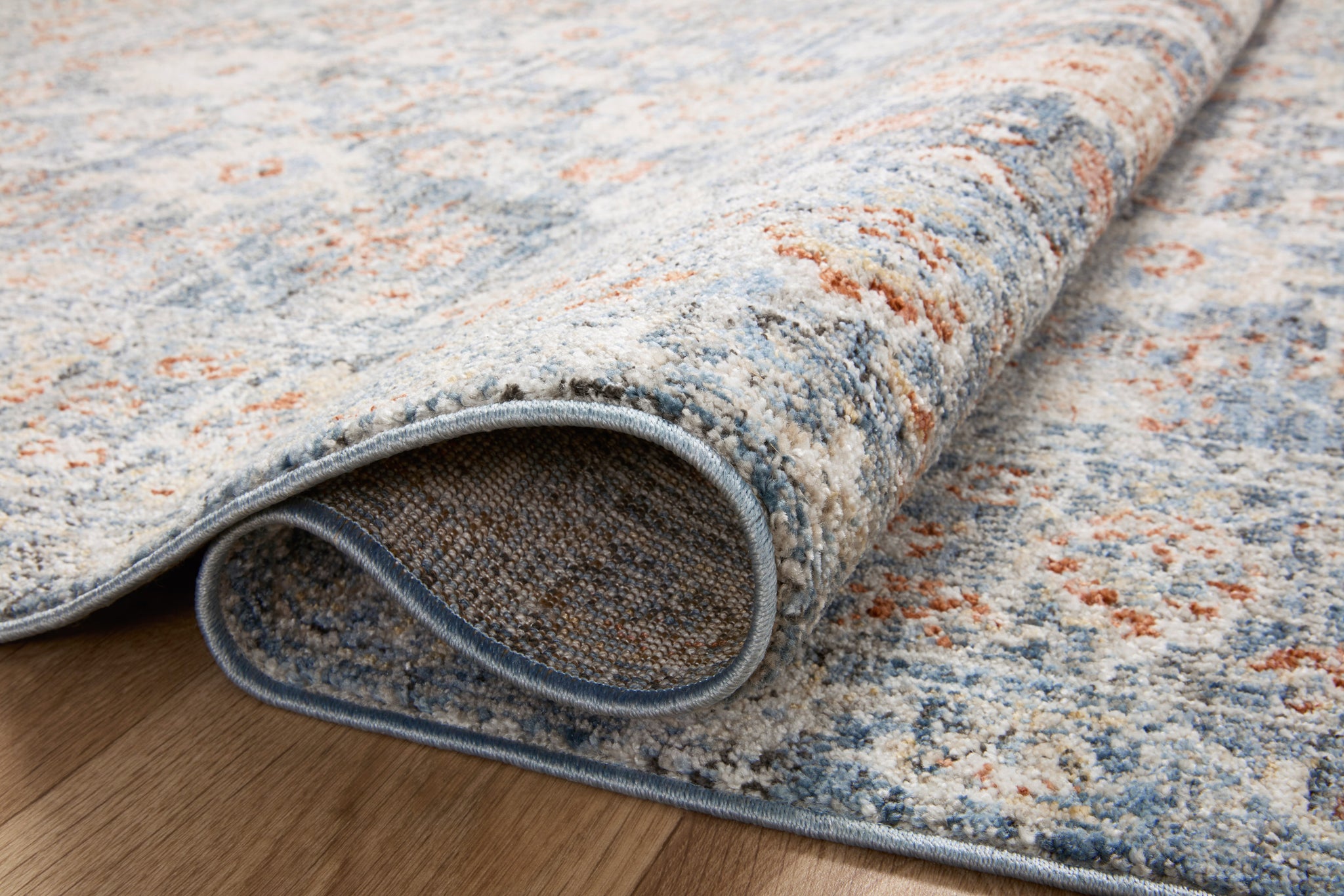 detail view of Odette Sky / Rust luxury Rug