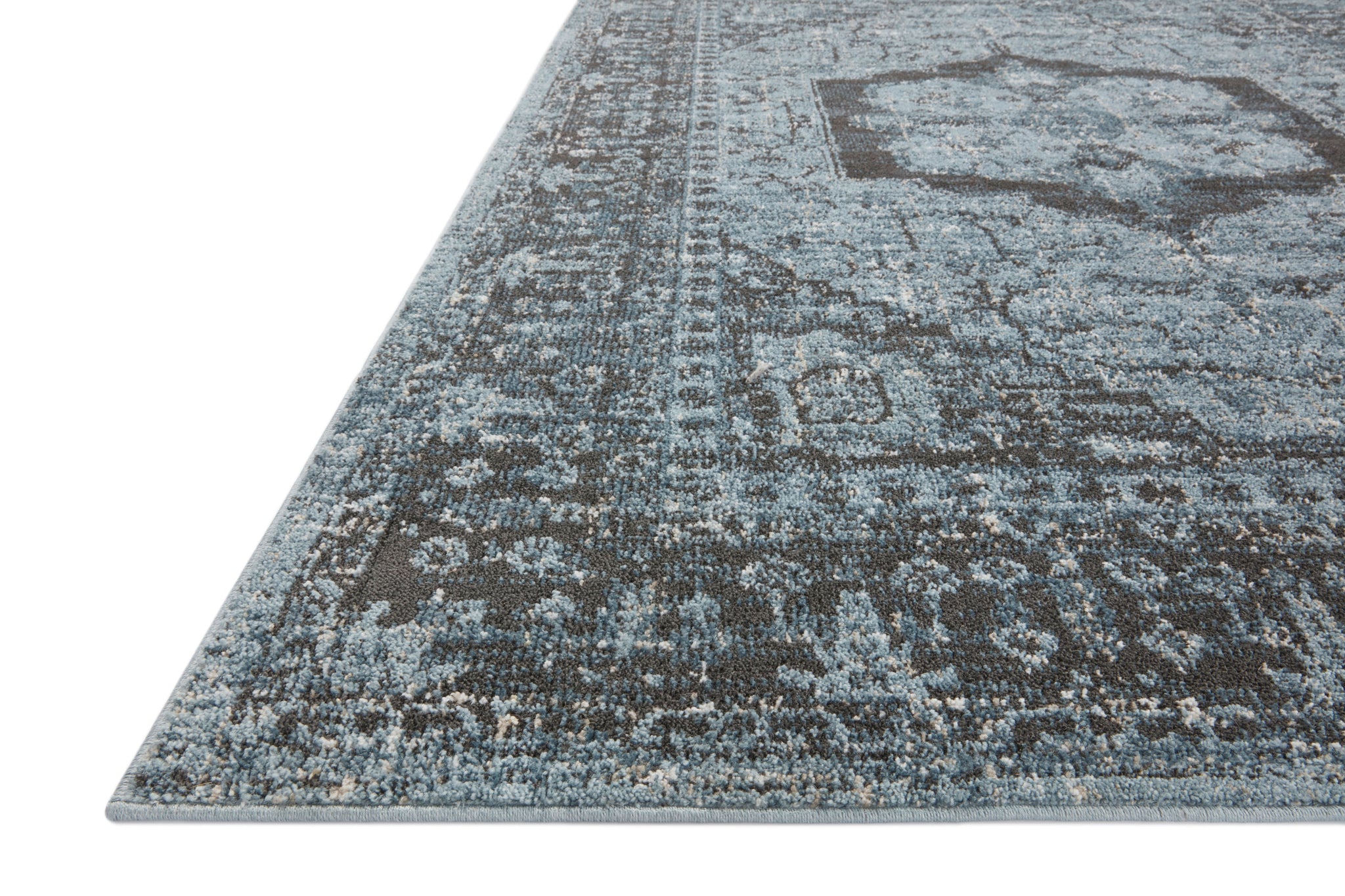 side view of Odette Sky / Charcoal luxury Rug