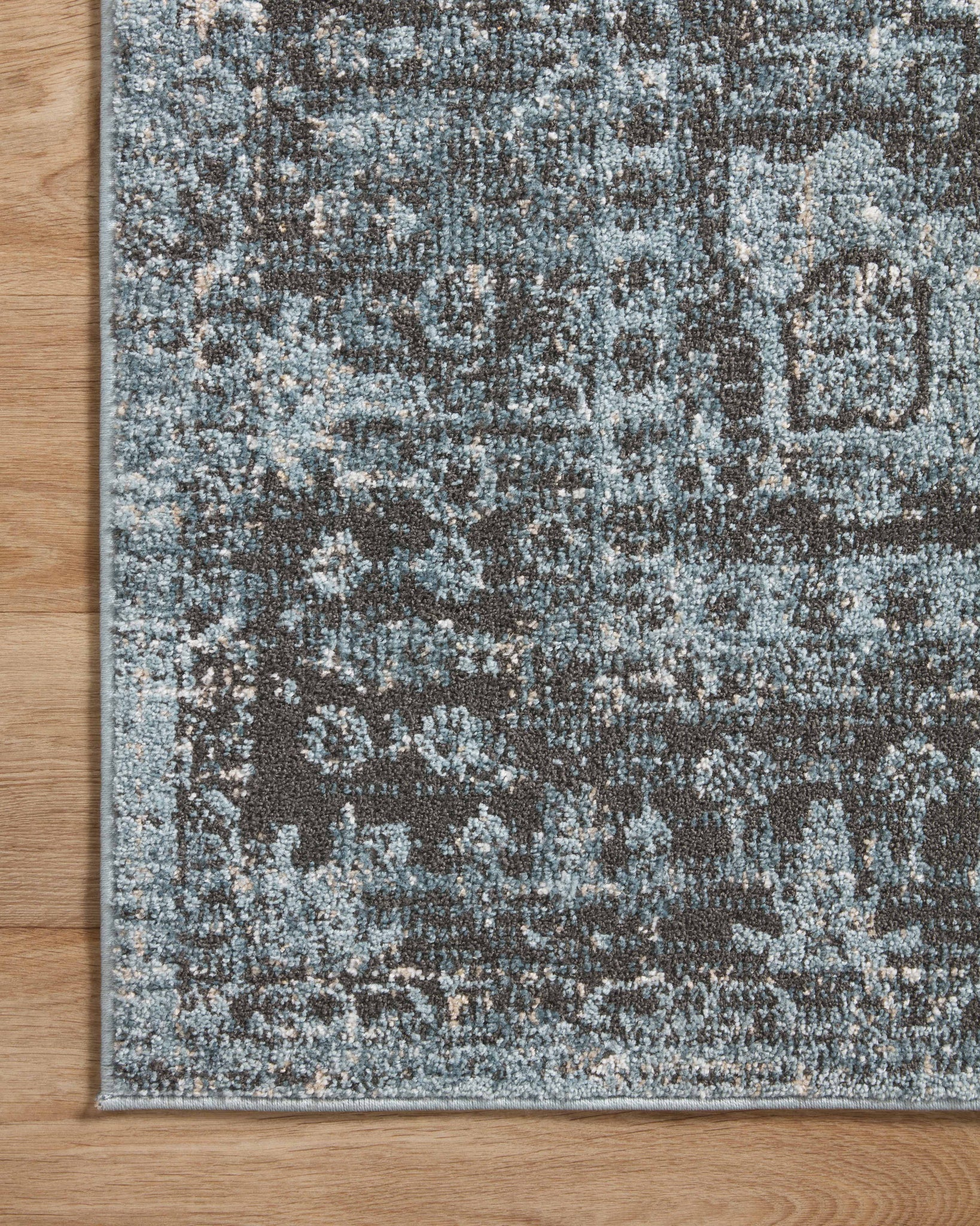 lifestyle view of Odette Sky / Charcoal luxury Rug
