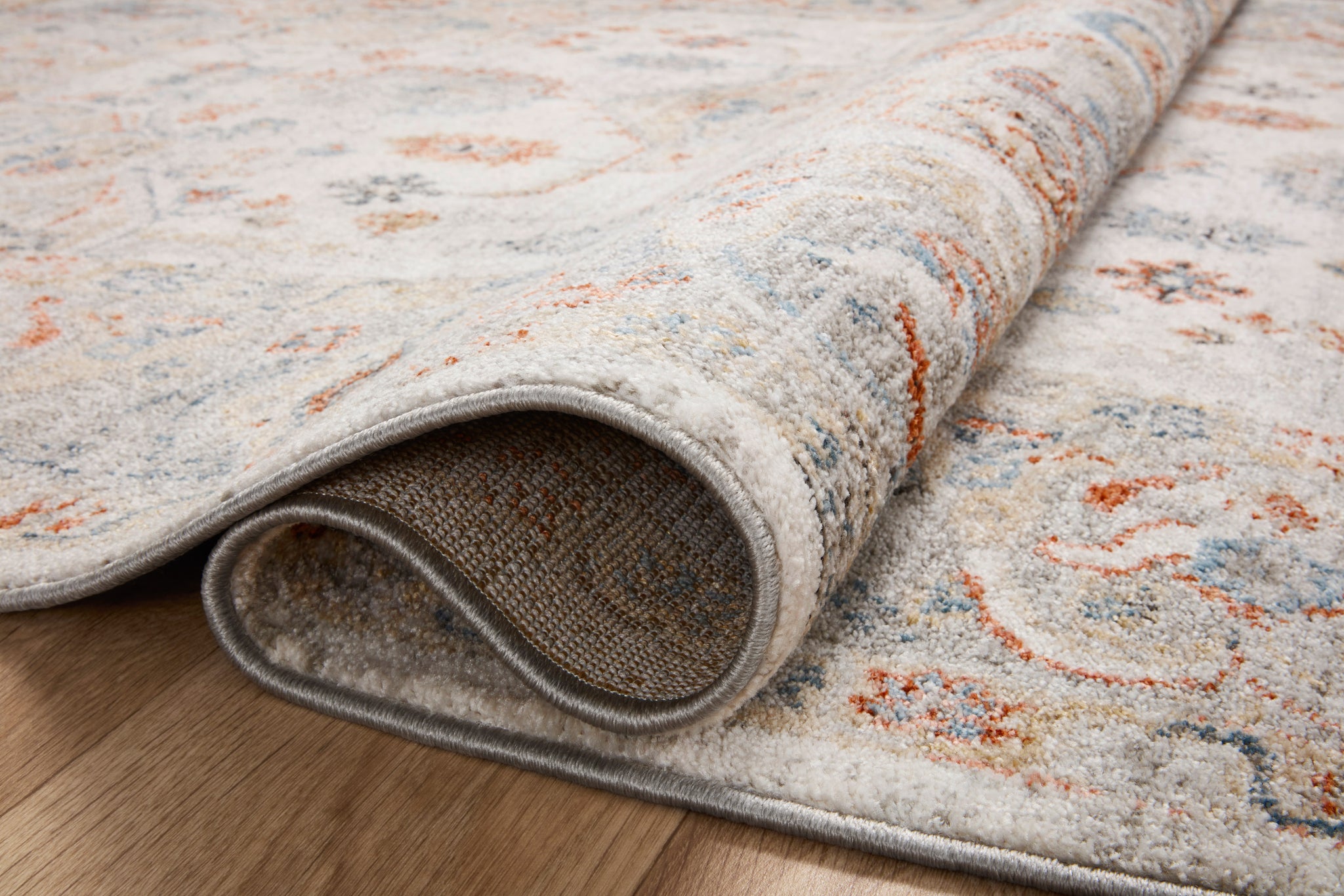 detail view of Odette Ivory / Multi luxury Rug