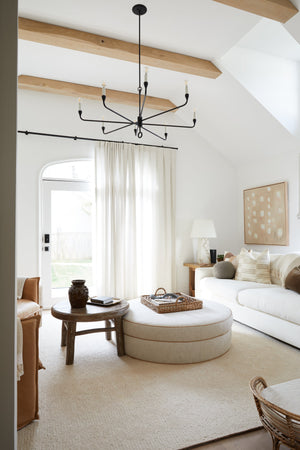 Orson Chandelier 41.5" styled in an elegant dining room for warm, layered light at Laurie Yapp Home.