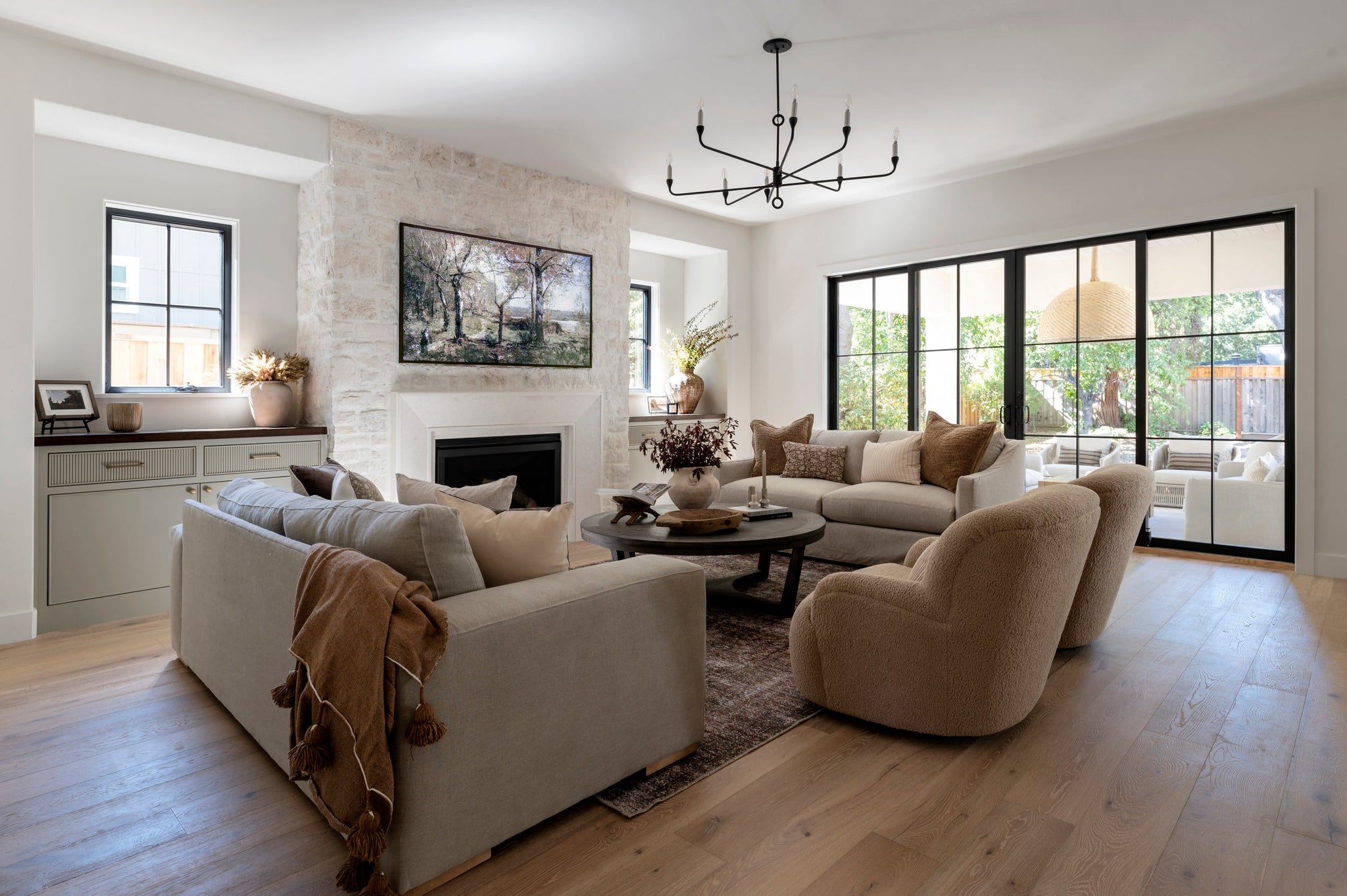 Orson Chandelier 41.5" styled in an elegant dining room for warm, layered light at Laurie Yapp Home.