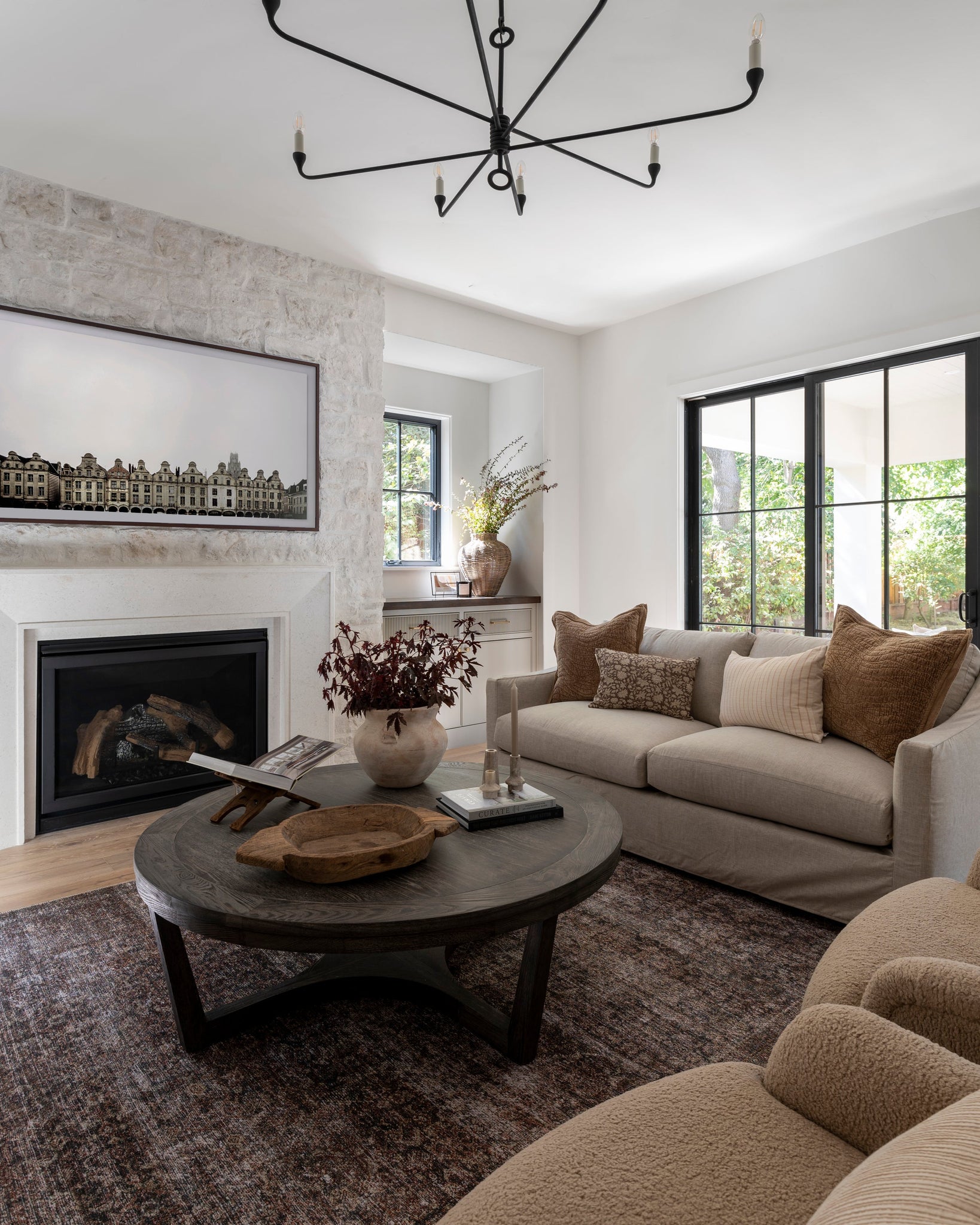 Orson Chandelier 41.5" styled in a two-story entry for warm, layered light at Laurie Yapp Home.