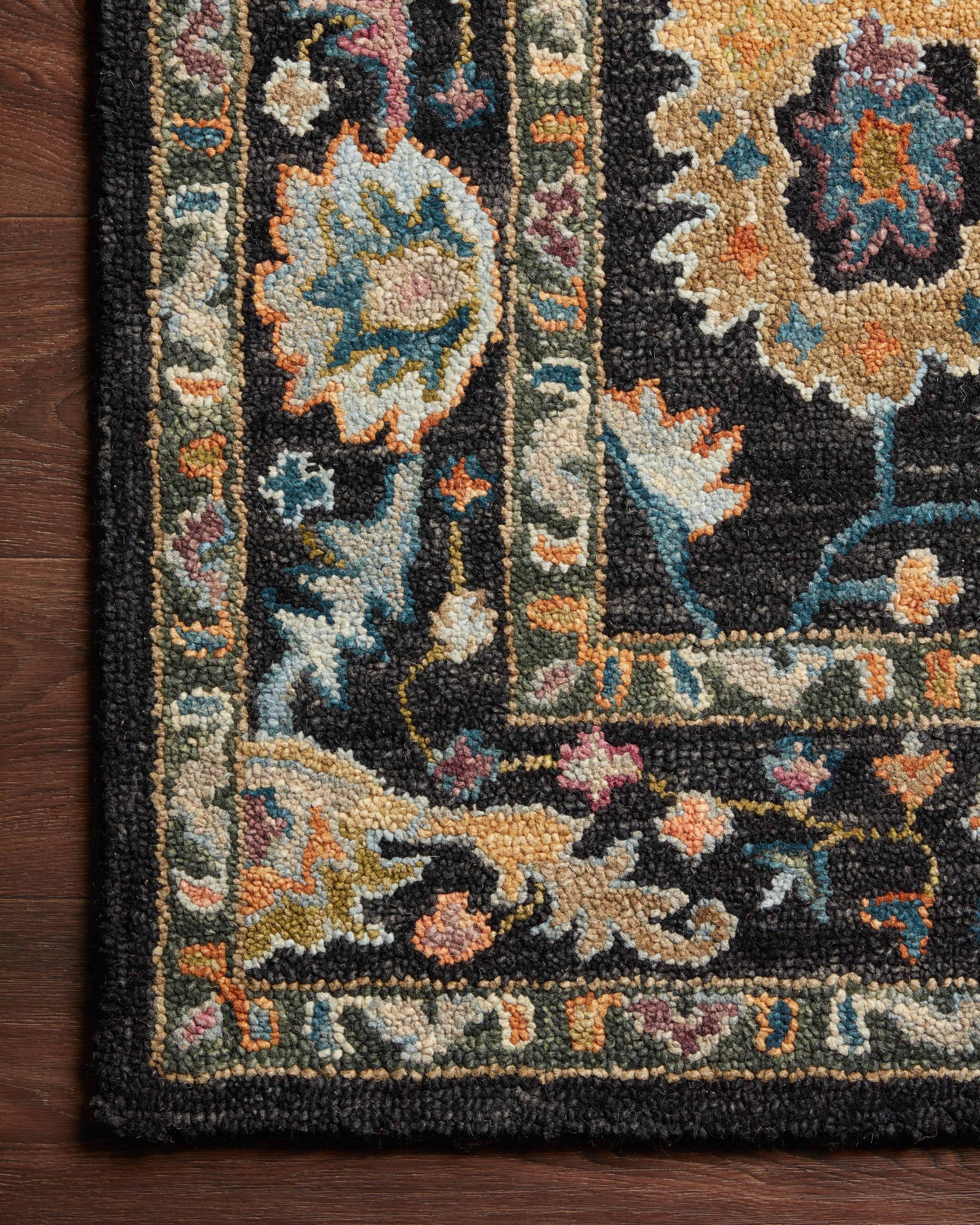 side view of Padma Black / Multi luxury Rug