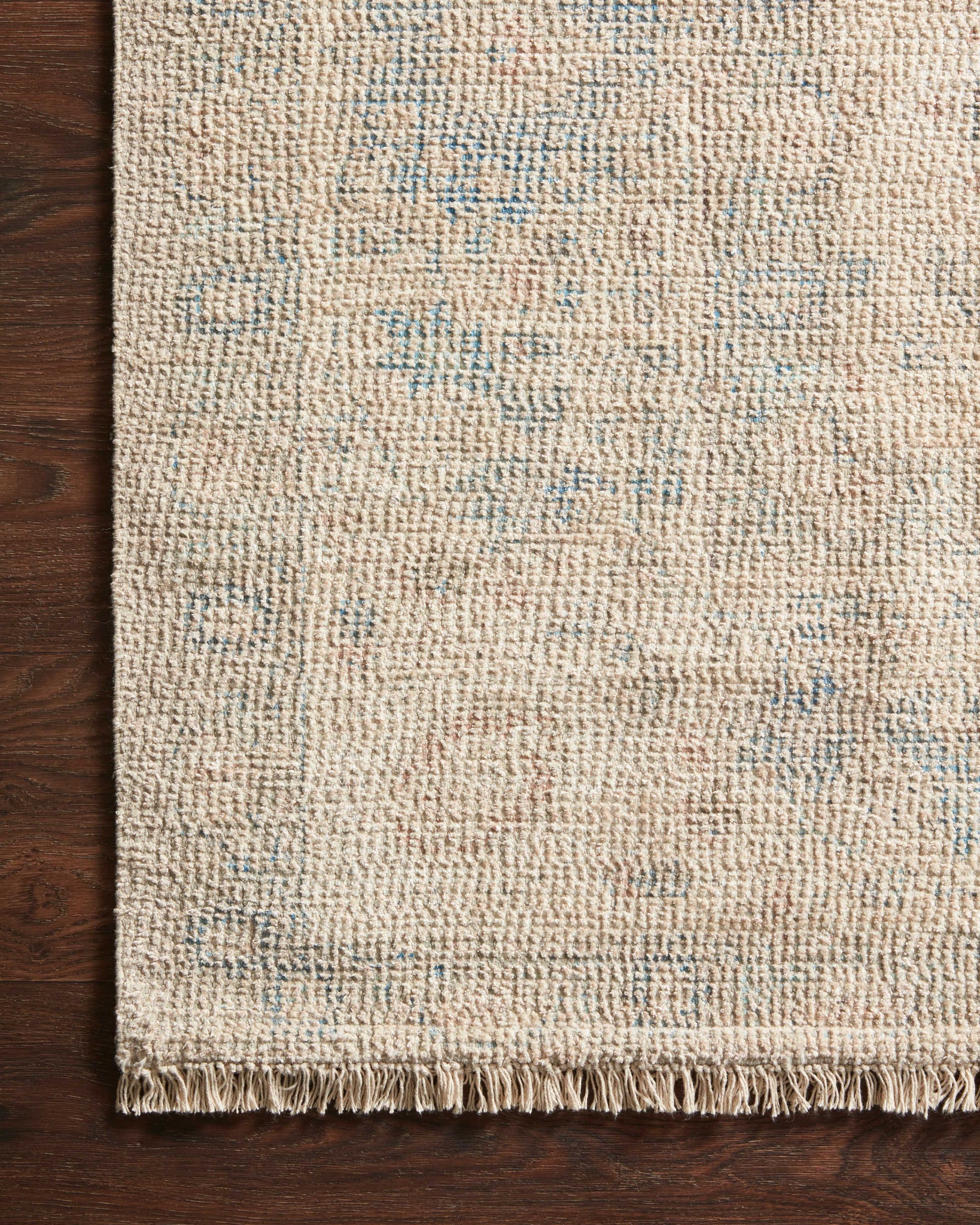 side view of Priya Natural / Blue luxury Rug